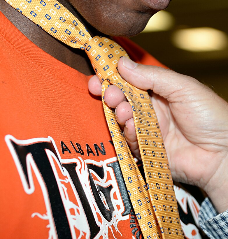 More than a dozen active-duty service members and retirees from Marine Corps Logistics Base Albany and Marine Corps Logistics Command demonstrate their strong ties to the local community by participating in a "Ties that Bind" event, June 19, at Phoebe Northwest Conference Center, Albany, Georgia.