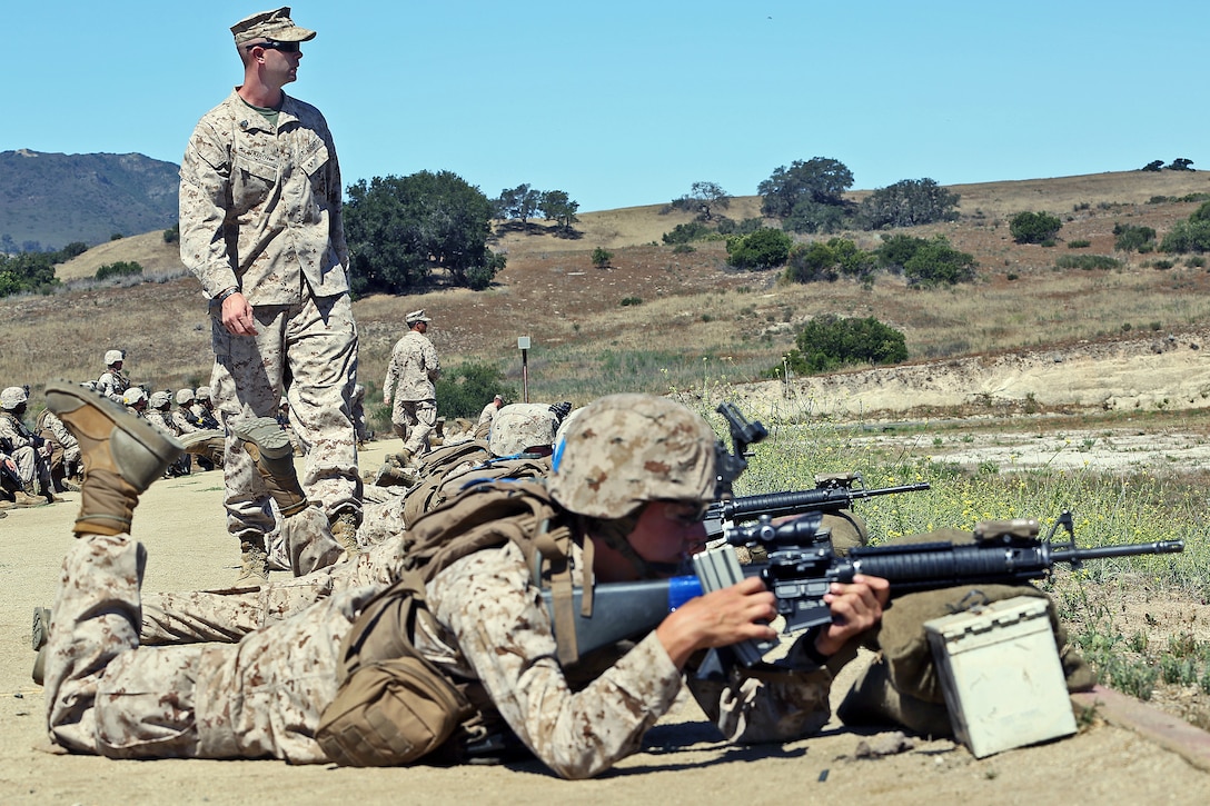 Combat instructors with Infantry Training Battalion, Bravo Company, guide new Marines through their first week in the field, reaffirming the basics of shooting and zeroing their weapons, Range 214, June 19.

Combat instructors teach young, fresh out of boot camp Marines in the skills Marines need to succeed in combat. These skills include land navigation, combat conditioning and combat marksmanship training with individual and crew-served weapons such as the M16A4 service rifle, M203 grenade launcher and AT-4 rocket launchers.