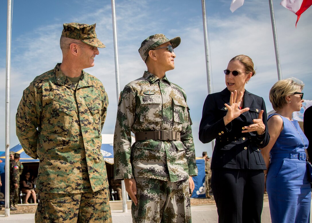 Brig. Gen. Christopher J. Mahoney, left, deputy commander, U.S. Marine Corps Forces, Pacific, converses with Piper Anne Wind Campbell, right, U.S. ambassador to Mongolia, before the opening ceremonies of Khaan Quest 2015, in Tavantolgoi, Mongolia, June 20, 2015. Khaan Quest is a regularly scheduled, multinational exercise hosted annually by Mongolian Armed Forces and co-sponsored by U.S. Army, Pacific, and U.S. Marine Corps Forces, Pacific. KQ15 is the latest in a continuing series of exercises designed to promote regional peace and security. This year marks the 13th iteration of this training event. (U.S. Marine Corps photo by Cpl. Hilda Becerra/Released)