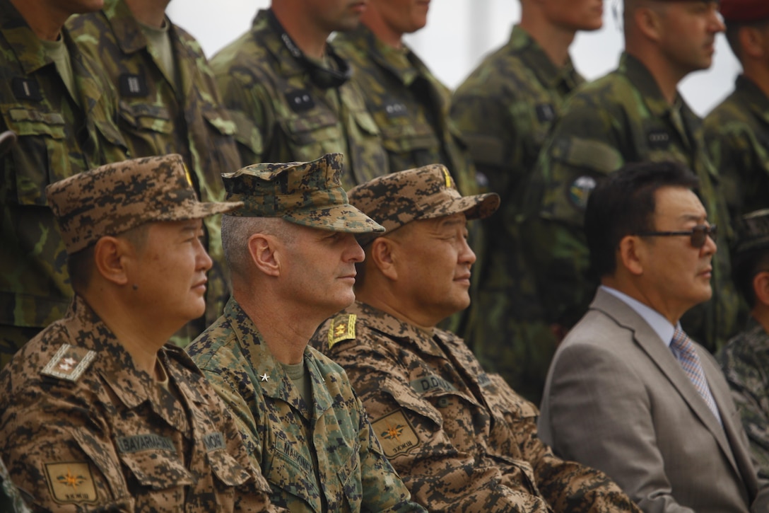 U.S. Marine Brig. Gen. Christopher J. Mahoney, center, deputy commander, U.S. Marine Corps Forces, Pacific, poses for a group photo during the opening ceremony of Exercise Khaan Quest 2015 at Five Hills Training Area in Ulaanbaatar, Mongolia, June 20, 2015. Khaan Quest is a regularly scheduled, multinational exercise hosted annually by Mongolian Armed Forces and co-sponsored by U.S. Army, Pacific, and U.S. Marine Corps Forces, Pacific. KQ15 is the latest in a continuing series of exercises designed to promote regional peace and security. This year marks the 13th iteration of this training event.