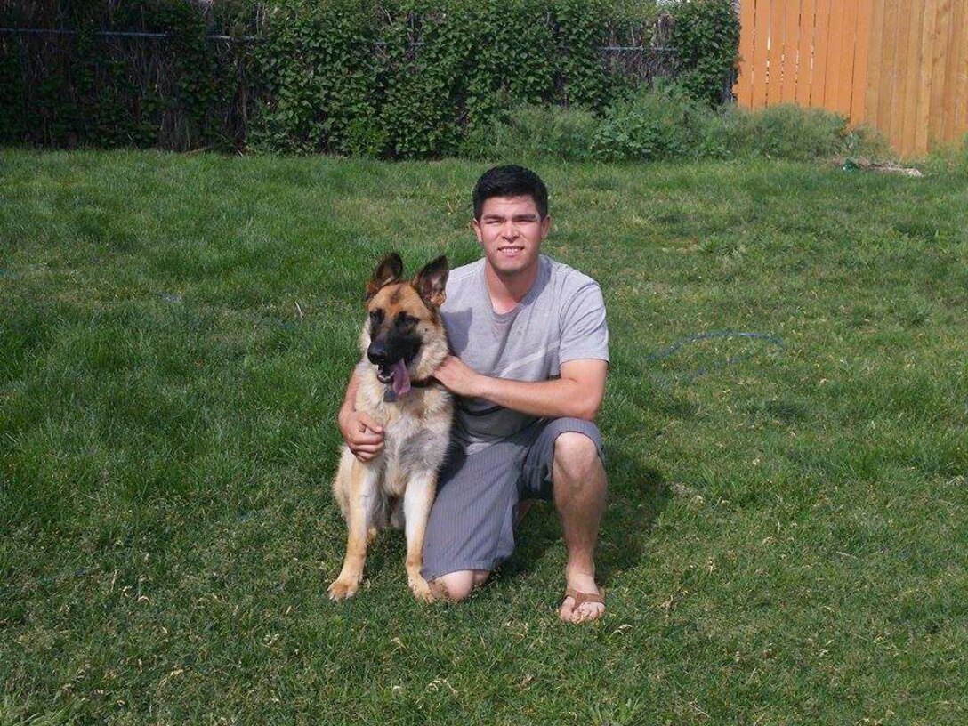 Timber, a German shepherd puppy adopted by 2nd Lt. David Casas, 319th Missile Squadron, poses for a photo at his home in Cheyenne, Wyo., June 15, 2015. Casas adopted Timber from the Cheyenne Animal Shelter after heavy planning and research. Due to his schedule, Casas relies on his roommates to help care for Timber. (U.S. Air Force photo by 2nd Lt. Veronica Perez)