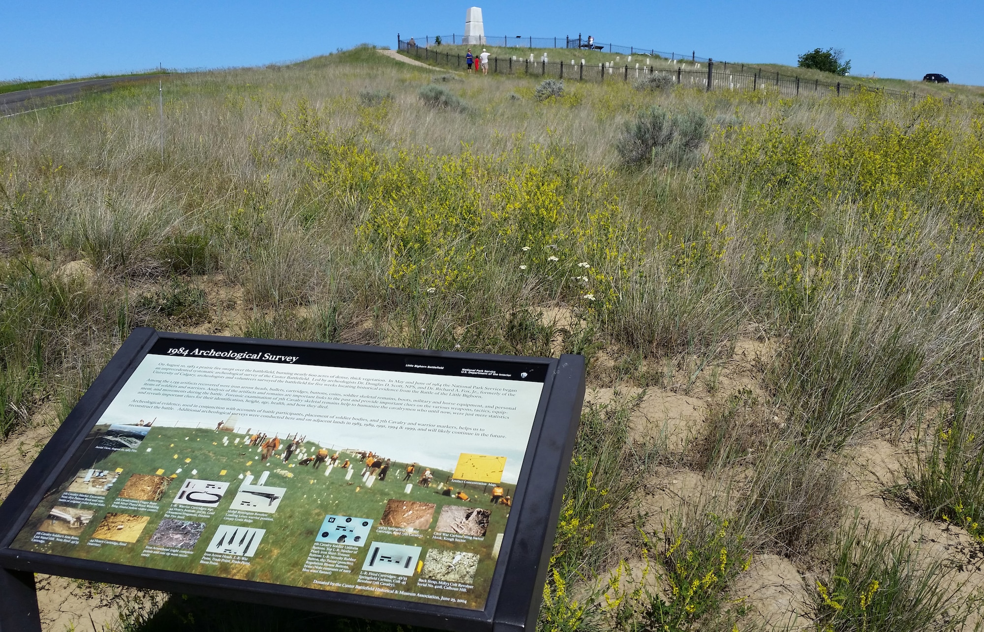 A sign at the base of Last Stand Hill explains how recent archeological evidence has influenced theories of what occurred June 25, 1876, at the Battle of Little Bighorn. Since none of the cavalrymen with Lt. Col. George Custer survived to recount this part of the battle, some events remain a mystery and evoke the imagination. (U.S. Air Force photo/John Turner)
