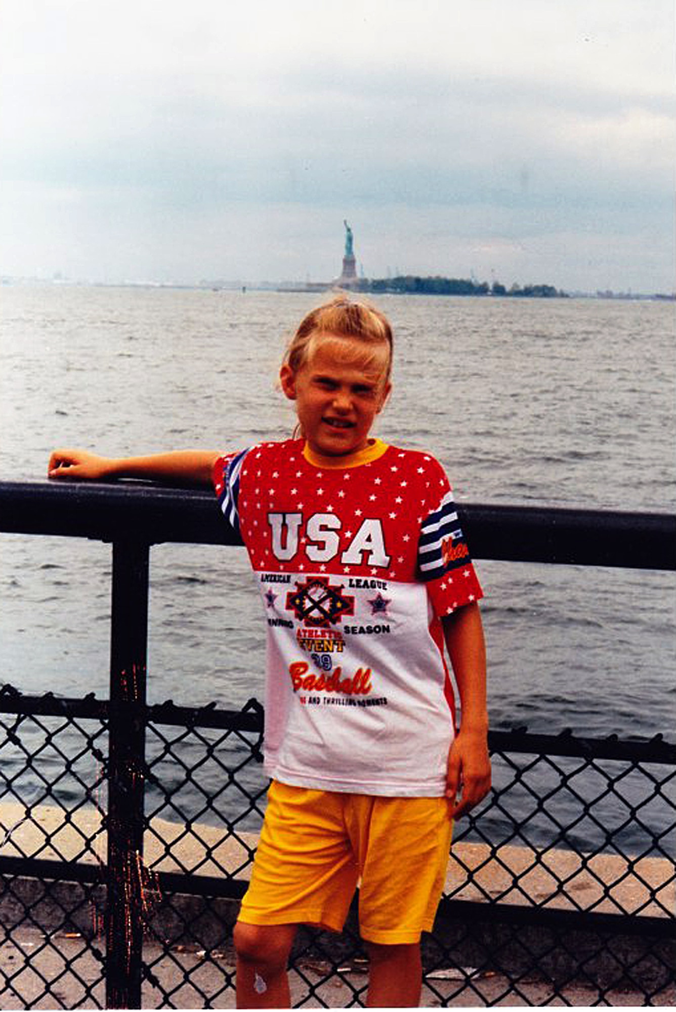 Sandra Mueller poses in front of the Statue of Liberty during one of her trips to the U.S. before becoming a citizen and joining the Air Force.  Mueller is currently responsible for monitoring logistic assessments to determine combat readiness for Task Force 214.  (Courtesy photo /Released)