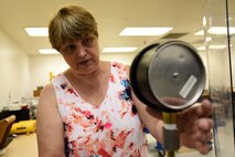 Candice Brown, 341st Maintenance Operation Squadron Precision Measurement Equipment Laboratory technician, uses specialized equipment to gauge and calibrate liquid and steam June 23, 2015, at Malmstrom Air Force Base, Mont.  . The PMEL shop supports the 341st Missile Wing, 19th RED HORSE, and provides lateral support to local bases. (U.S. Air Force photo/Chris Willis)