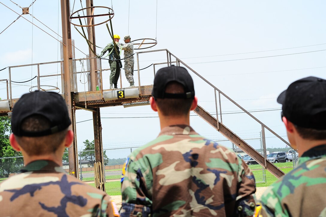 Airman 1st Class Samuel Miller, 14th Medical Group Aerospace Physiology Technician, prepares to demonstrate a Parachute Landing Fall to Civil Air Patrol Cadets June 22 on Columbus Air Force Base, Mississippi. The Cadets also got to experience the altitude chamber and basic egress training. (U.S. Air Force photo/Airman Daniel Lile)