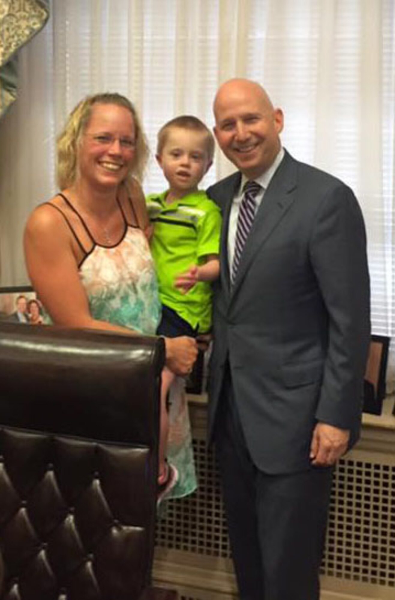 Master Sgt. Carrie Huot, 712th Aircraft Maintenance Squadron first sergeant, and her son Leopold, stand with Delaware Governor Jack Markell in his office June 10, 2015. Markell signed the state's Able Act, allowing individuals with disabilities to have a tax-free savings account similar to 529 accounts. (Courtesy photo)