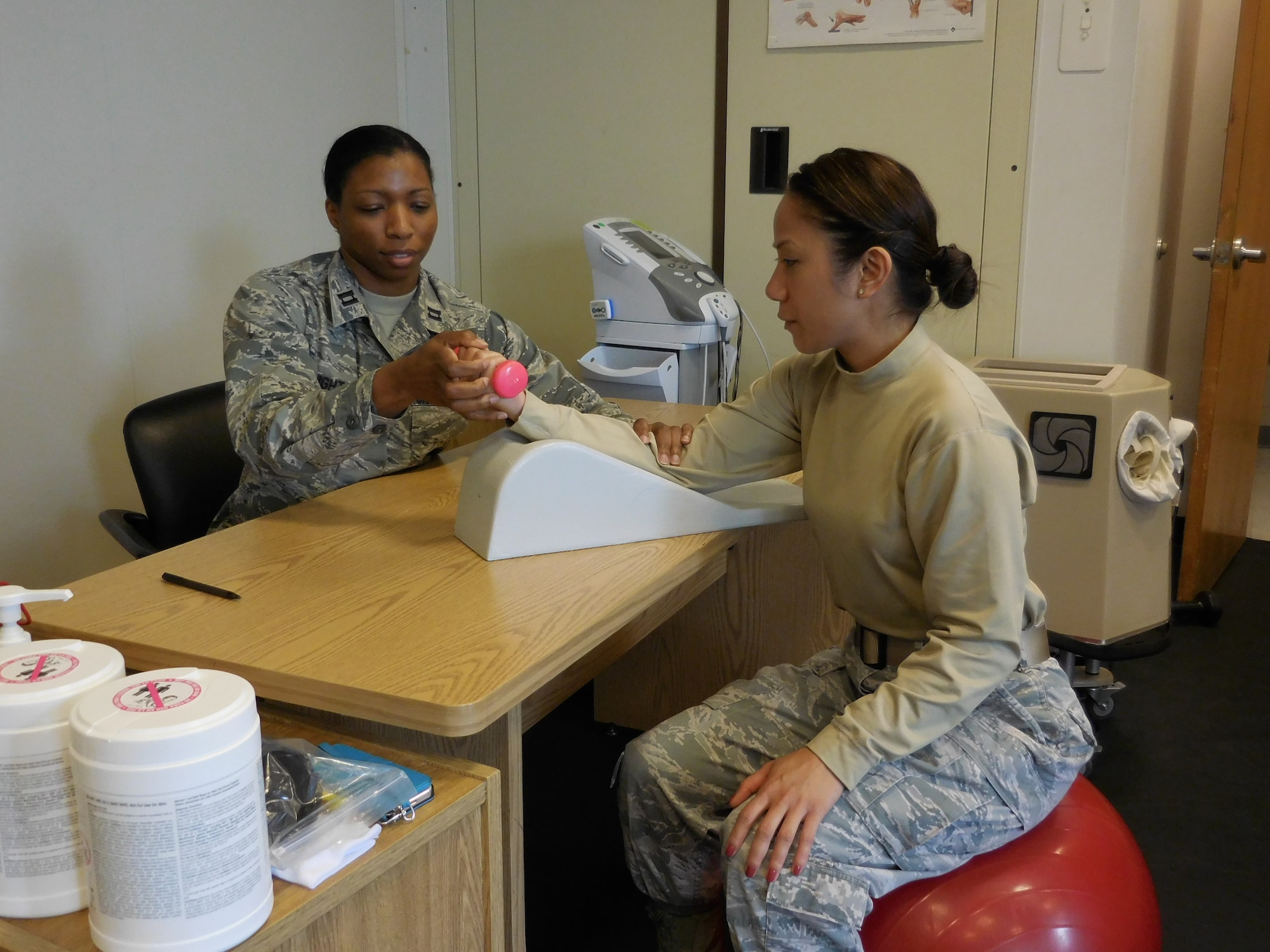 Capt. Marquita Knight, 779th Medical Operations Squadron, Occupational Therapist  treats Staff Sgt. Lerma Orara, 779th Medical Operations Squadron, Medical Technician with hand therapy. 