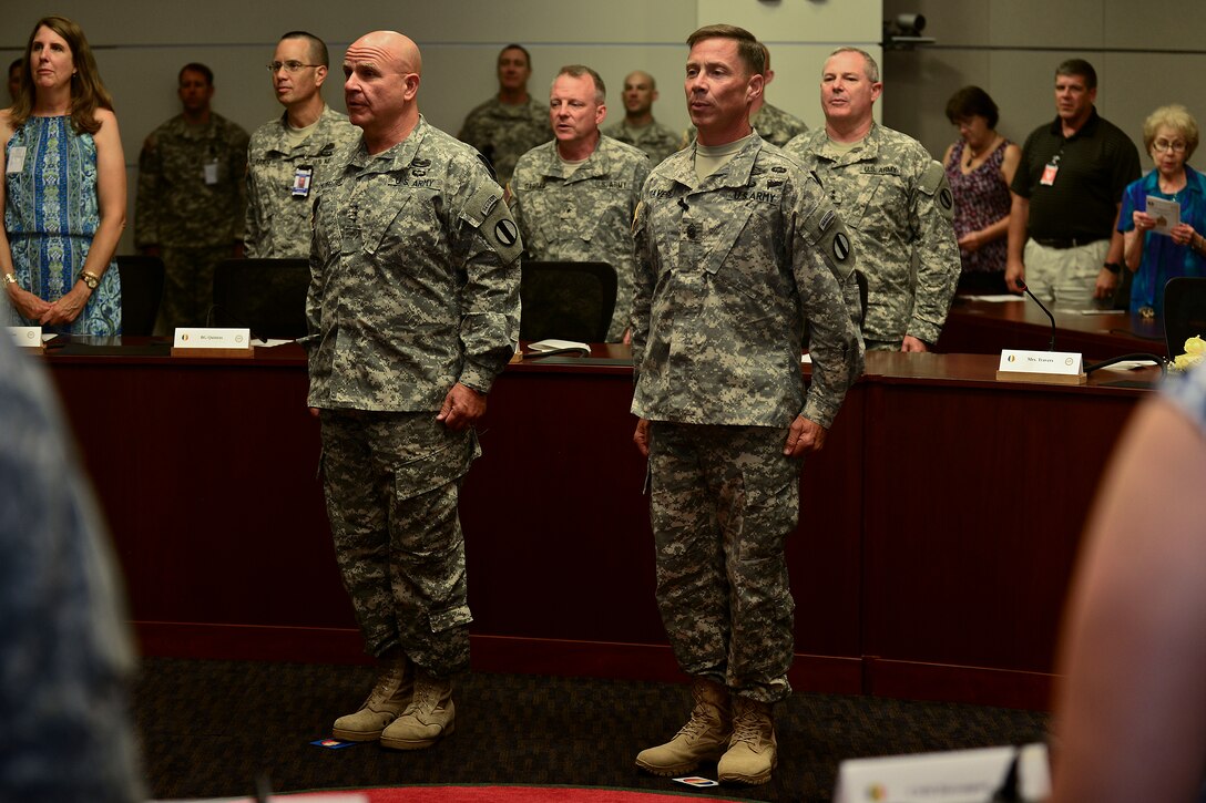 Members of the crowd sing the U.S. Army song during the assumption of responsibility ceremony for U.S. Army Sgt. Maj. Stephen Travers, Army Capabilities Integration Center command sergeant major, at Fort Eustis, Va., June 19, 2015. Travers served as the command sergeant major of the National Training Center at Fort Irwin, Ca., before assuming responsibility here. (U.S. Air Force photo by Senior Airman Kimberly Nagle/Released)