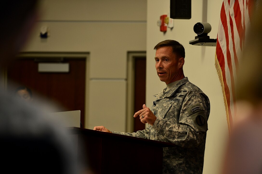 U.S. Army Sgt. Maj. Stephen Travers, Army Capabilities Integration Center command sergeant major, addresses the crowd during his assumption of responsibility ceremony at Fort Eustis, Va., June 19, 2015. Travers has served in numerous positions throughout his career such as machine gunner, team leader, platoon sergeant and recruiter. (U.S. Air Force photo by Senior Airman Kimberly Nagle/Released)