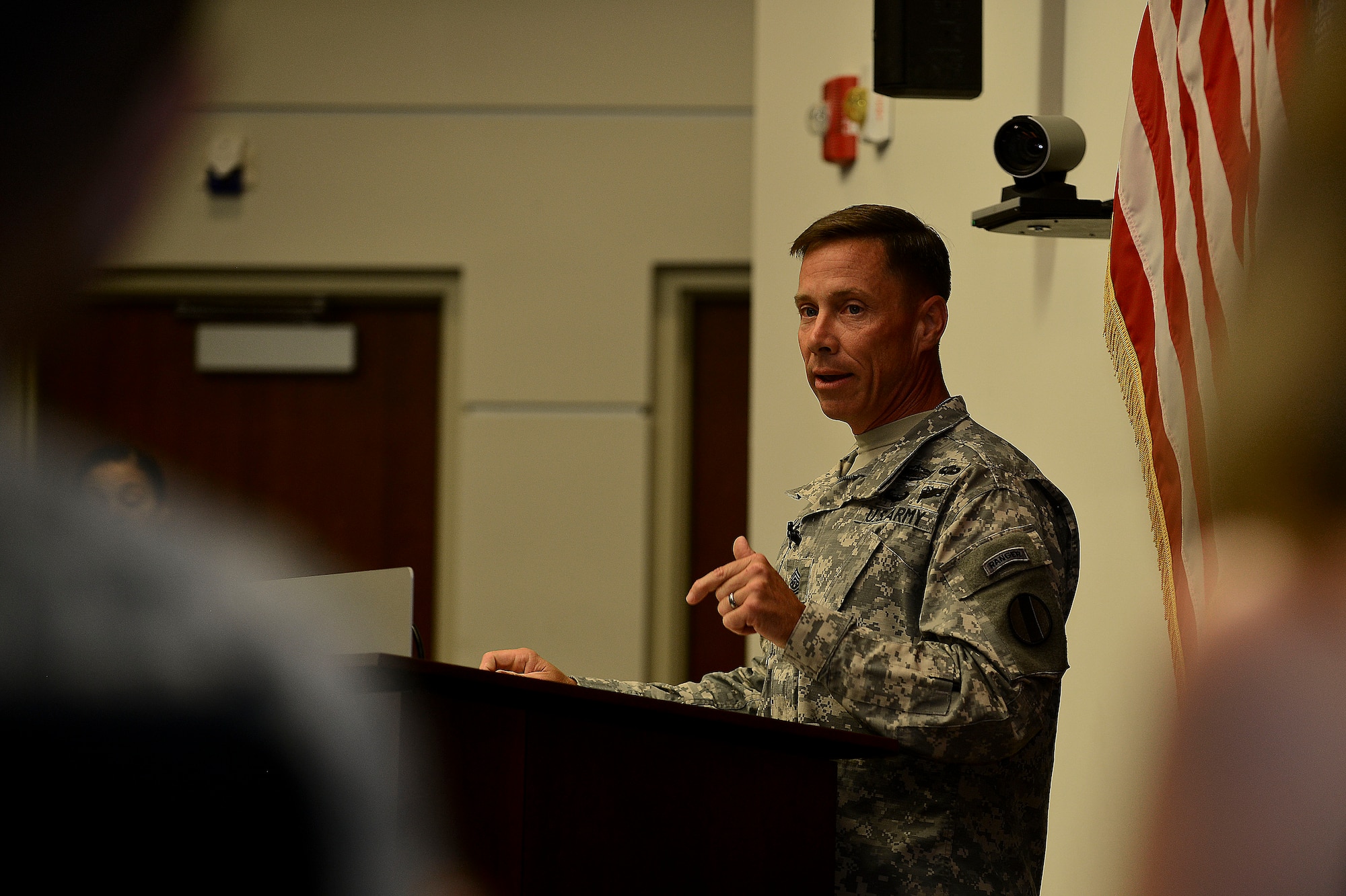 U.S. Army Sgt. Maj. Stephen Travers, Army Capabilities Integration Center command sergeant major, addresses the crowd during his assumption of responsibility ceremony at Fort Eustis, Va., June 19, 2015. Travers has served in numerous positions throughout his career such as machine gunner, team leader, platoon sergeant and recruiter. (U.S. Air Force photo by Senior Airman Kimberly Nagle/Released)