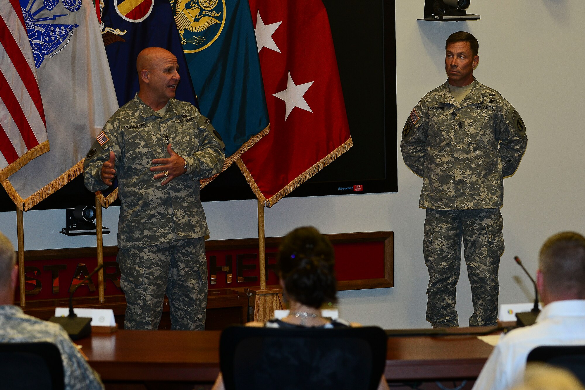 U.S. Army Lt. Gen. H. R. McMaster, Army Capabilities Integration Center director and U.S. Army Training and Doctrine Command deputy commanding general, left, speaks before Sgt. Maj. Stephen Travers, ARCIC incoming command sergeant major, assumes responsibility of ARCIC at Fort Eustis, Va., June 19, 2015. McMaster welcomed Travers, along with his wife to the ARCIC family and said he can’t wait to serve alongside him.  (U.S. Air Force photo by Senior Airman Kimberly Nagle/Released)