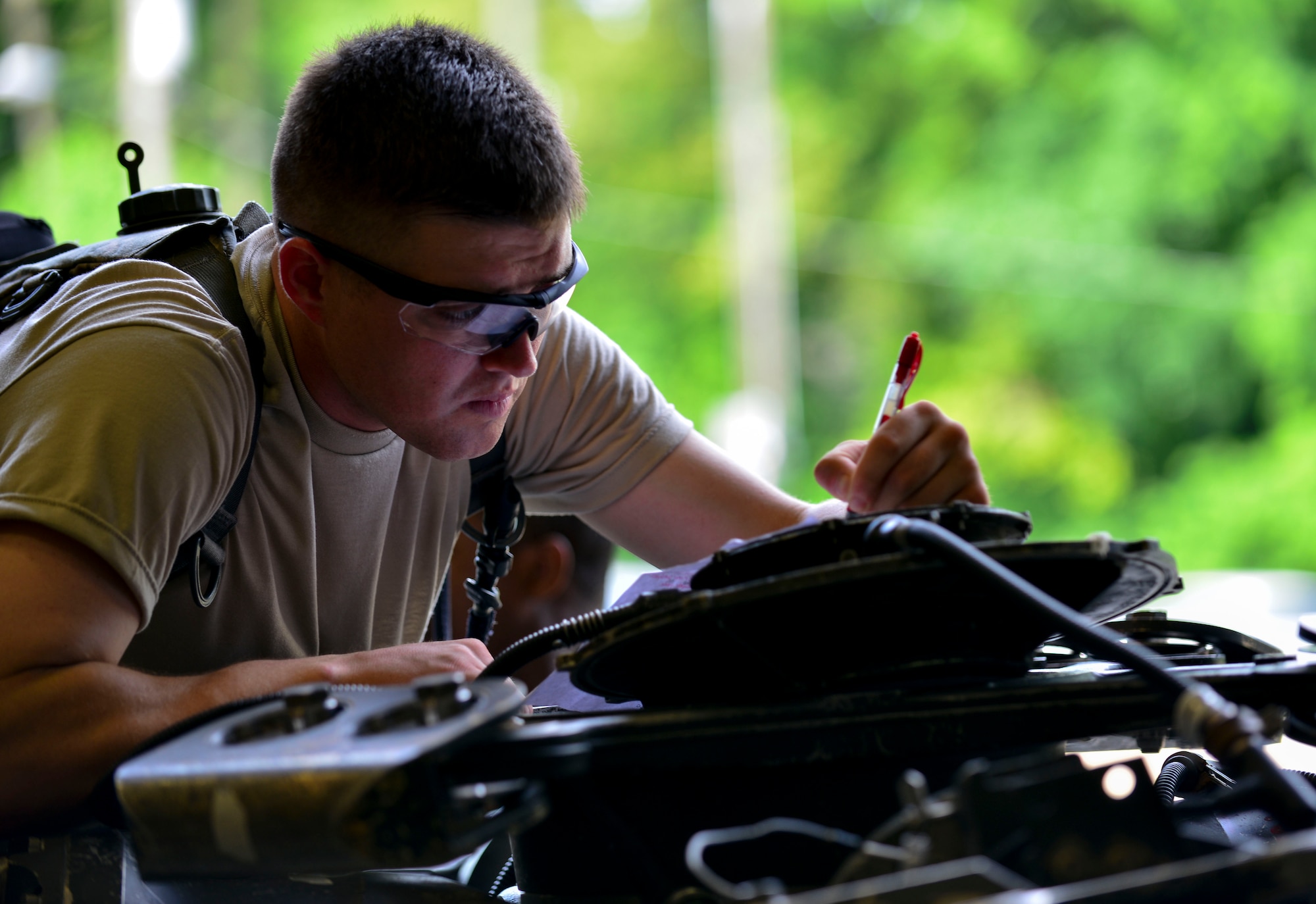 U.S. Army Pfc. Andrew Herring, 128th Aviation Brigade Advanced Individual Training student, identifies parts of a UH-60 Blackhawk’s main rotor at Fort Eustis, Va., June 18, 2015. As future aircraft maintainers, the students must successfully identify individual components of the aircraft’s systems. (U.S. Air Force photo by Staff Sgt. Natasha Stannard/Released)