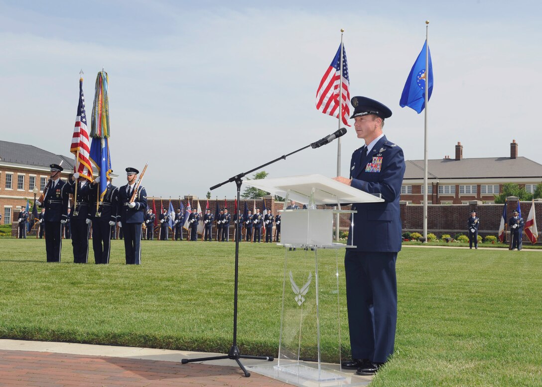 Col. Brad Hoagland, 11th Wing/Joint Base Andrews commander, speaks at the 11th Operations Group change of command ceremony June 23, 2015, at Joint Base Anacostia-Bolling, District of Columbia. Hoagland presided over the ceremony, transferring command from Col. Richard Lindlan, outgoing 11 OG commander, to Col. Jon Julian, incoming 11 OG commander. (U.S. Air Force photo by Senior Airman Preston Webb/RELEASED)