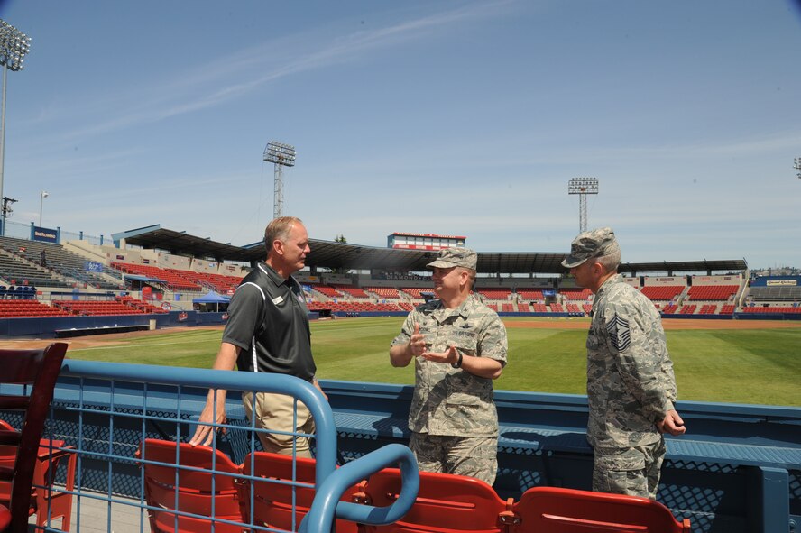 Col. Brian McDaniel, 92nd Air Refueling Wing commander, and Chief Master Sgt. Christian Pugh, 92nd ARW command chief, discuss ways the base and the Spokane Indians baseball team can help each other with Otto Klein, Spokane Indians Baseball senior vice president, June 22, 2015, in Spokane, Wash. The colonel and the chief received an up close look at Avista Stadium and learned about the history of the team. (U.S. Air Force photo/Senior Airman Sam Fogleman)