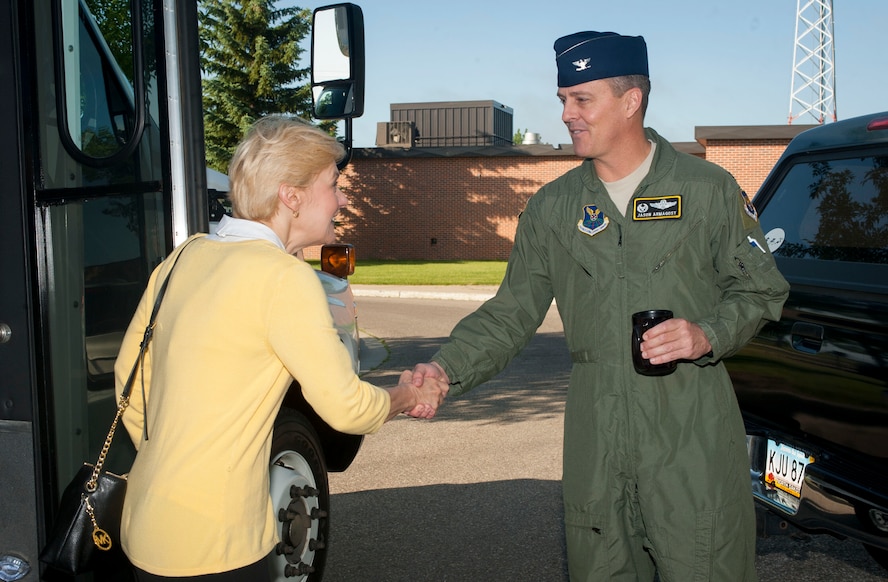 Ms. Anita E. Friedt, Nuclear and Strategic Policy principal deputy assistant secretary, is greeted by Col. Jason Armagost, 5th Bomb Wing commander at Minot Air Force Base N.D., June 17, 2015. Friedt toured both the 5th BW and 91st Missile Wing as part of a treaty compliance visit. (U.S. Air Force photo/Stephanie Morris)