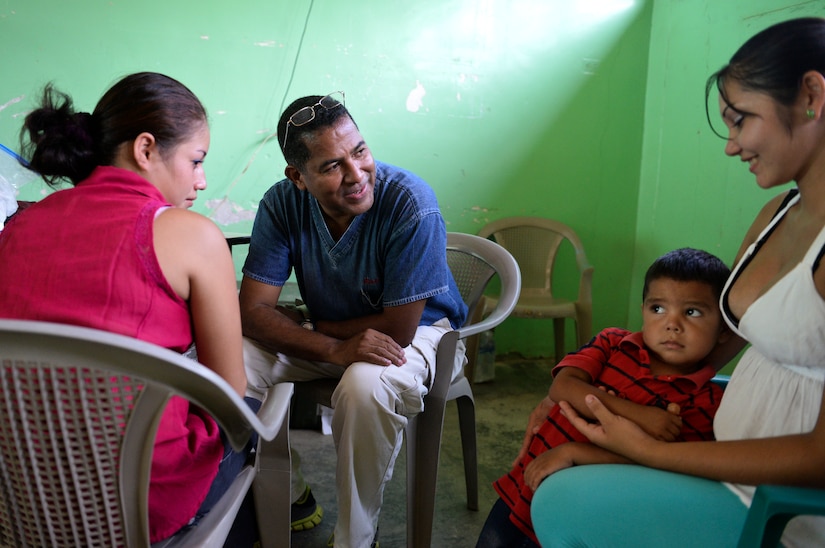 Dr. Miguel Coello, a Joint Task Force – Bravo Medical Element medical liaison officer, assures Iliana Vasquez that her pregnancy is progressing successfully during a medical readiness training exercise June 2, 2015, at Corinto Cortes, Honduras. Iliana visited the MEDRETE with concerns that her unborn child was not moving, but left happy and hoping to see MEDEL visit their town again. (U.S. Air Force photo by Staff Sgt. Jessica Condit)