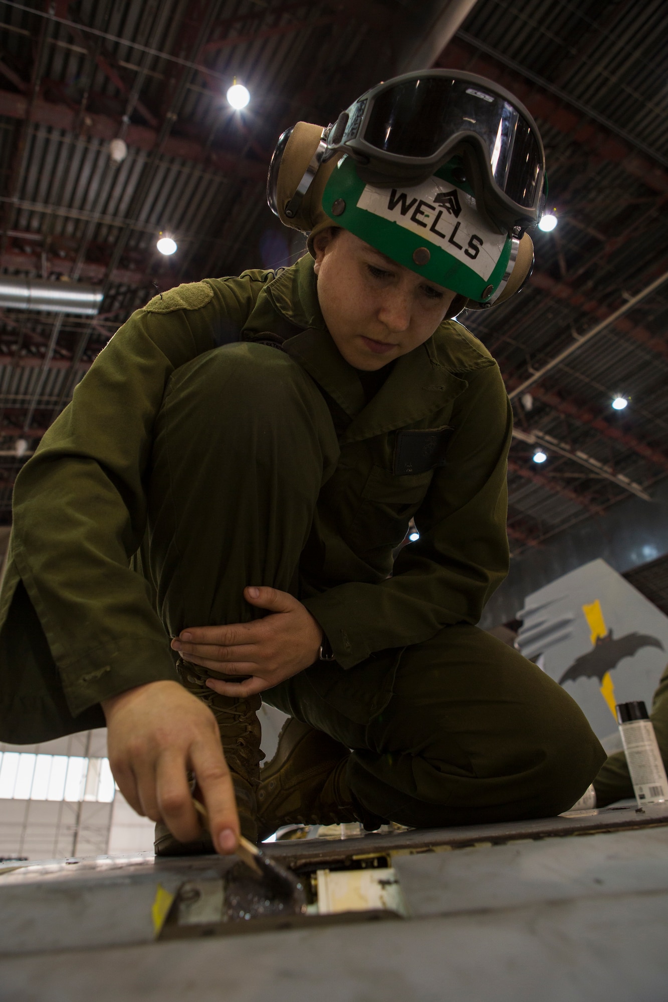 U.S. Marine Corps Cpl. Kristen J. Wells, an airframes mechanic with the Marine All-Weather Fighter Attack Squadron (VMFA [AW]) 242, 1st Marine Aircraft Wing, replaces sealant on a U.S. Marine Corps FA-18D Hornet assigned to VMFA (AW)-242 during Exercise Northern Edge 15 at Eielson Air Force Base, Alaska, June 22, 2015. Northern Edge is Alaska’s premier joint training exercise designed to practice operations, techniques and procedures as well as enhance interoperability among the services. Thousands of service members from active duty, reserve and National Guard units are involved. (U.S. Marine Corps photo by MCIPAC Combat Camera, Cpl. Suzanne Dickson/Released)