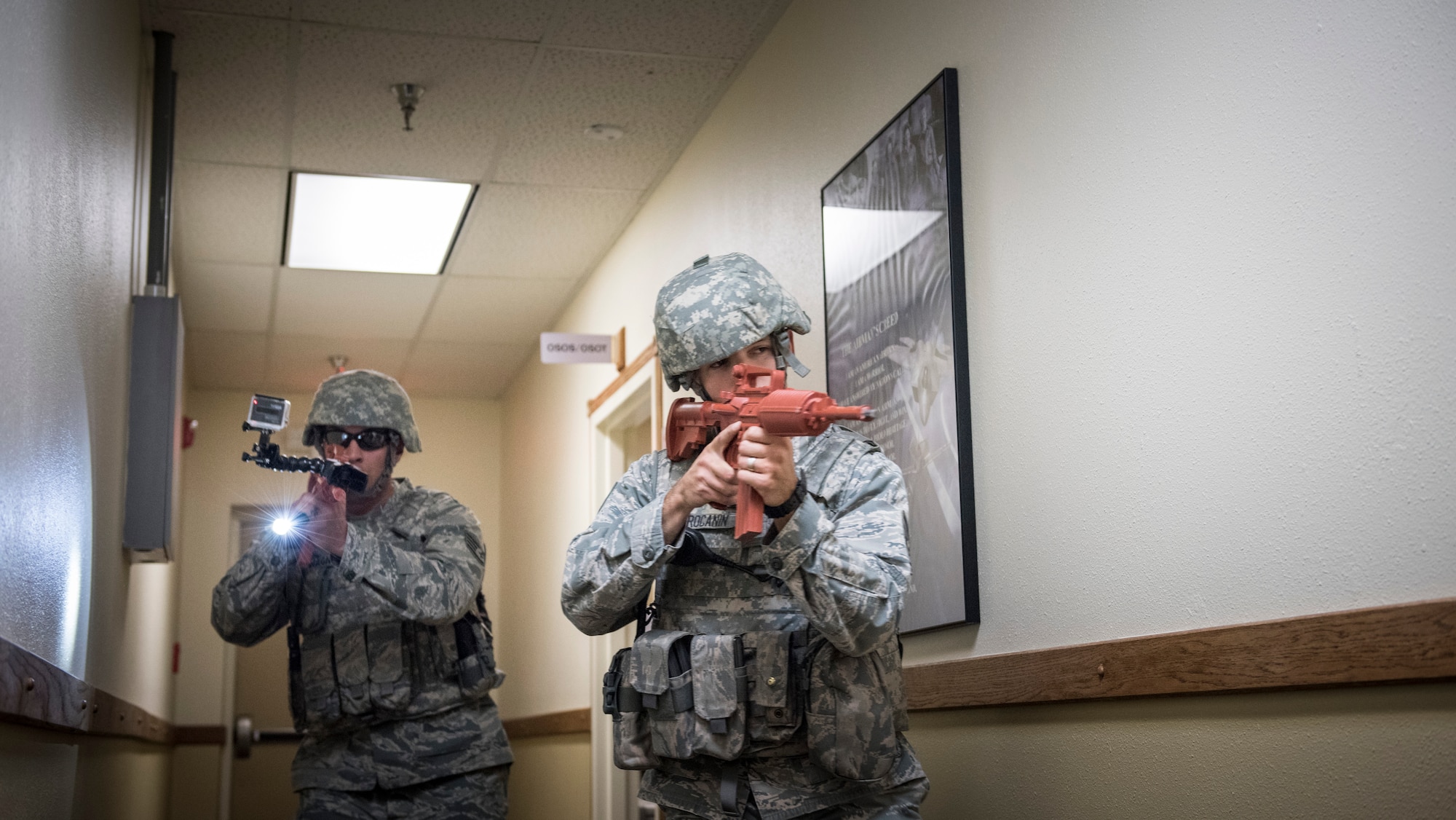 Tech. Sgt. Scot Procanin, 366th Security Forces Squadron flight chief, and Staff Sgt. Tony Wagner, 366th SFS assistant flight chief, clear the building after apprehending the active shooter during the exercise June 18, 2015, at Mountain Home Air Force Base, Idaho. They were the first on-scene after the call was made about the active shooter. (U.S. Air Force photo by Airman 1st Class Jeremy L. Mosier/RELEASED)