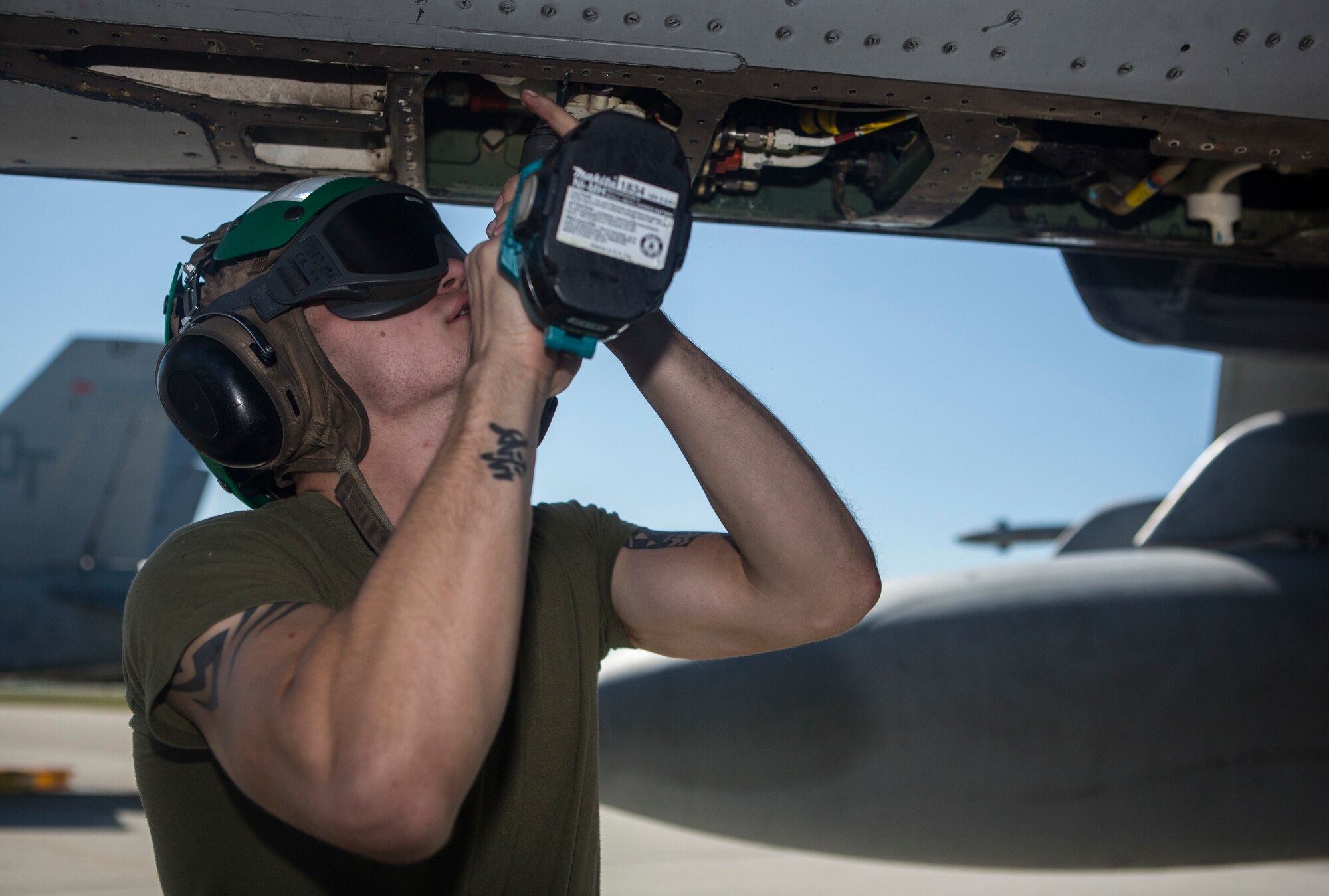 U.S. Marine Corps Lance Cpl. Jesse Key, Marine All-Weather Fighter Attack Squadron 242, 1st Marine Aircraft Wing, airframes mechanic, conducts maintenance on a U.S. Marine Corps FA-18D Hornet during Exercise Northern Edge 15 at Eielson Air Force Base, Alaska, June 18, 2015. Northern Edge is Alaska’s premier joint training exercise designed to practice operations, techniques and procedures as well as enhance interoperability among the services. Thousands of Airmen, Soldiers, Sailors, Marines and Coast Guardsmen from active duty, Reserve and National Guard units are involved. (U.S. Marine Corps photo by Staff Sgt. Jeffrey D. Anderson/ Released)