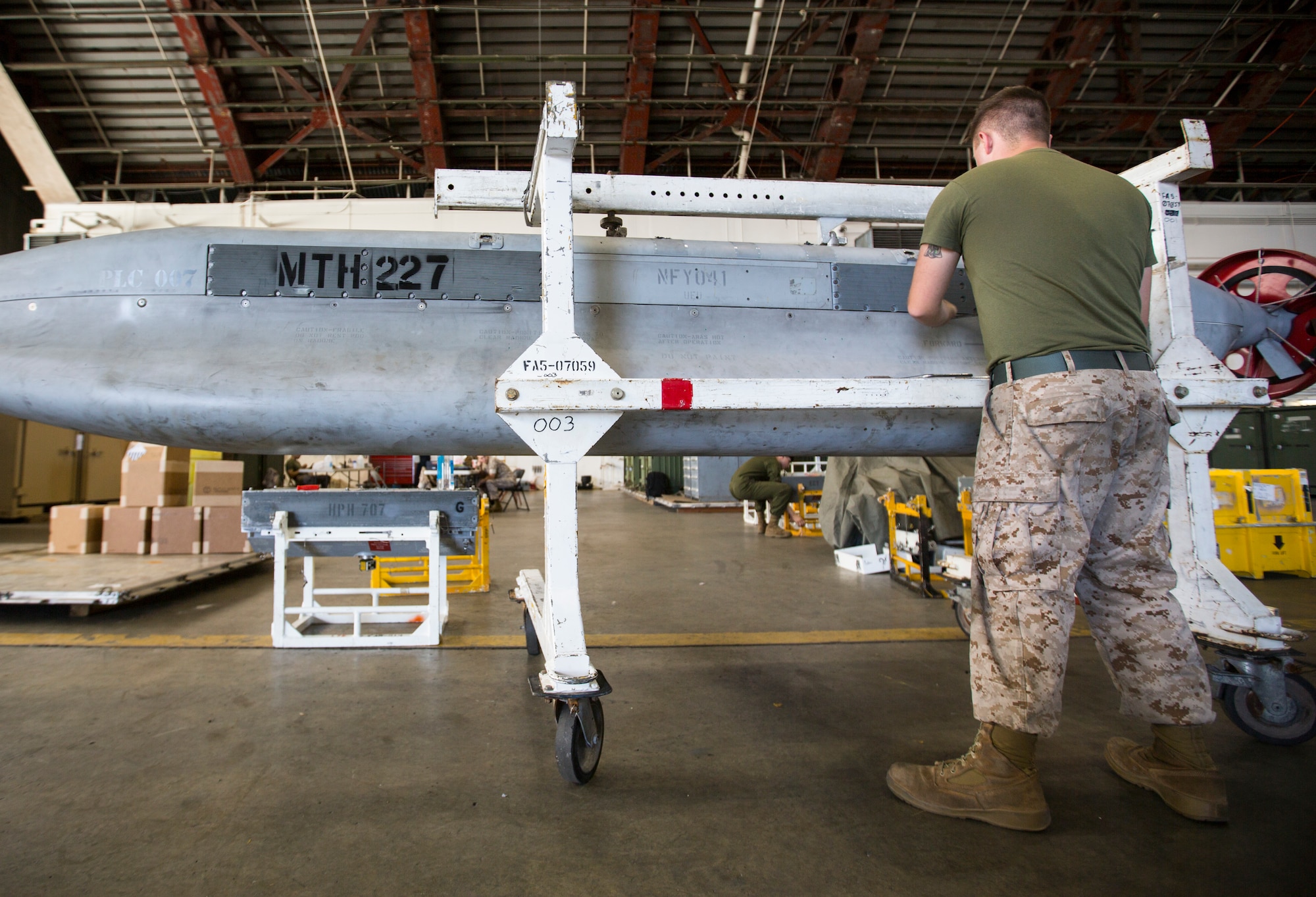 U.S. Marine Corps Cpl. Shane Riley, Marine Tactical Electronic Warfare Squadron 2, 2nd Marine Aircraft Wing, electronic counter measure systems technician, conducts maintenance on an airborne integrated jamming system for a U.S. Marine Corps EA-6B Prowler during Exercise Northern Edge 15 at Eielson Air Force Base, Alaska, June 18, 2015. Northern Edge is Alaska’s premier joint training exercise designed to practice operations, techniques and procedures as well as enhance interoperability among the services. Thousands of Airmen, Soldiers, Sailors, Marines and Coast Guardsmen from active duty, Reserve and National Guard units are involved. (U.S. Marine Corps photo by MCIPAC Combat Camera Staff Sgt. Jeffrey D. Anderson/ Released)