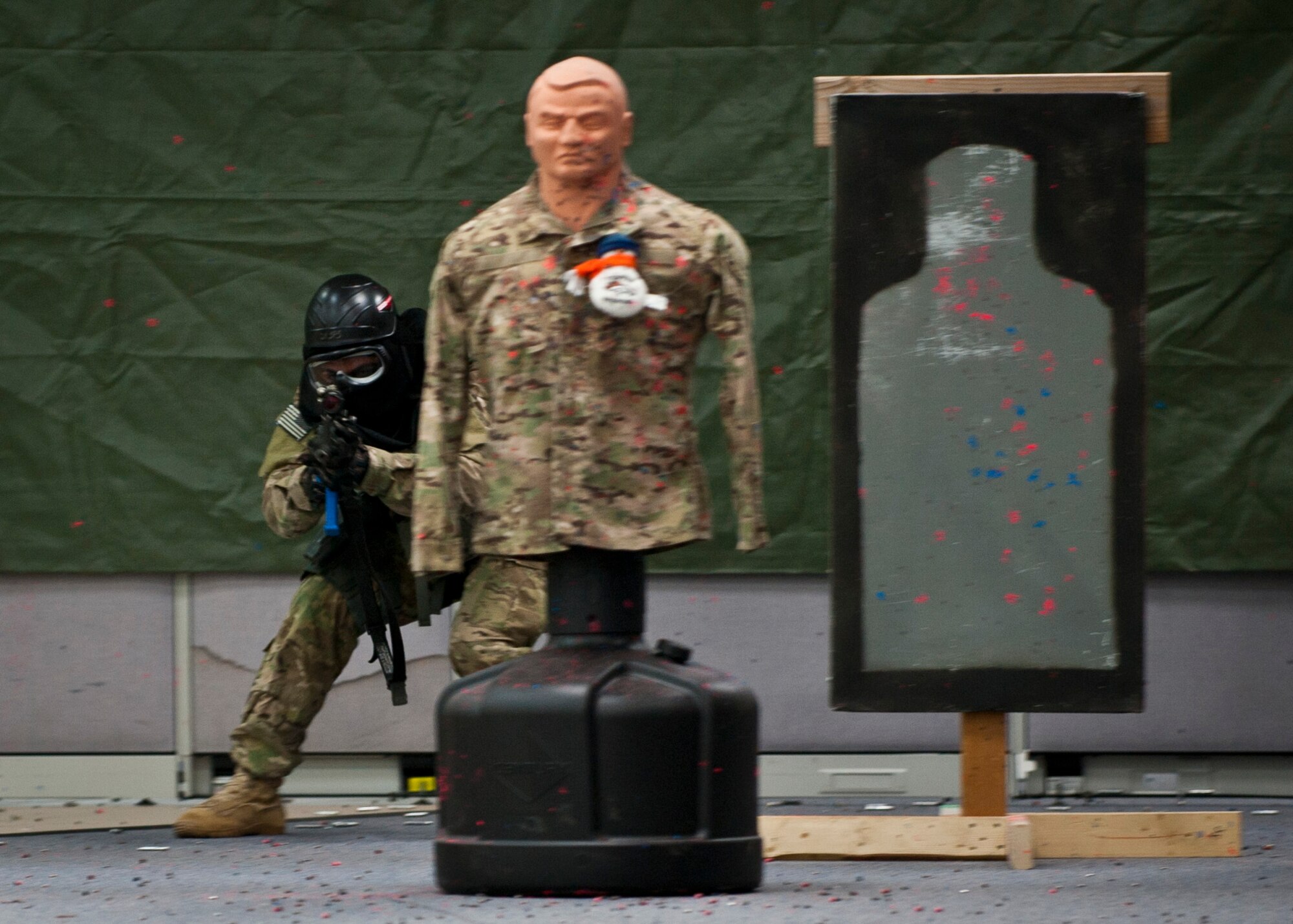PETERSON AIR FORCE BASE, Colo. – A 721st Security Forces Squadron member, playing the role of the “enemy,” seeks to take out the forces advancing on him during an annual training mission at the 21st Security Forces Training Complex, June 16. 721st SFS members conducted an active shooter, live-fire training using non-lethal training ammunition, which allows for the most realistic force-on-force training. (U.S. Air Force photo by Airman 1st Class Rose Gudex)