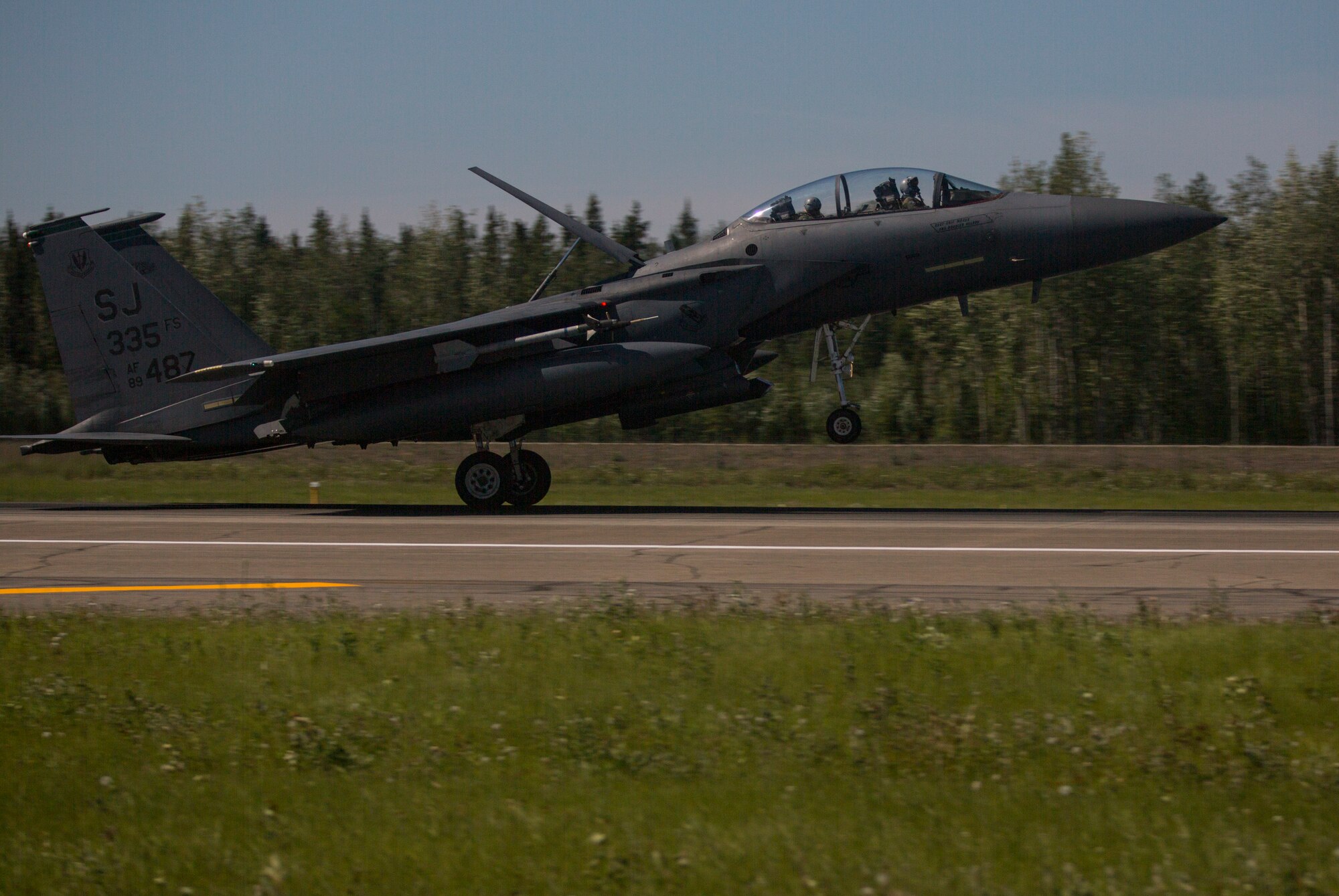 A U.S. Air Force F-15E Strike Eagle aircraft assigned to the 4th Fighter Wing, Seymour Johnson Air Force Base, N.C., lands at Eielson Air Force Base, Alaska, June 18, 2015, following a training mission during Exercise Northern Edge 2015. Northern Edge is Alaska’s premier joint training exercise designed to practice operations, techniques and procedures as well as enhance interoperability among the services. Thousands of Airmen, Soldiers, Sailors, Marines and Coast Guardsmen from active duty, Reserve and National Guard units are involved. (U.S. Marine Corps photo by Staff Sgt. Jeffrey D. Anderson/ Released)