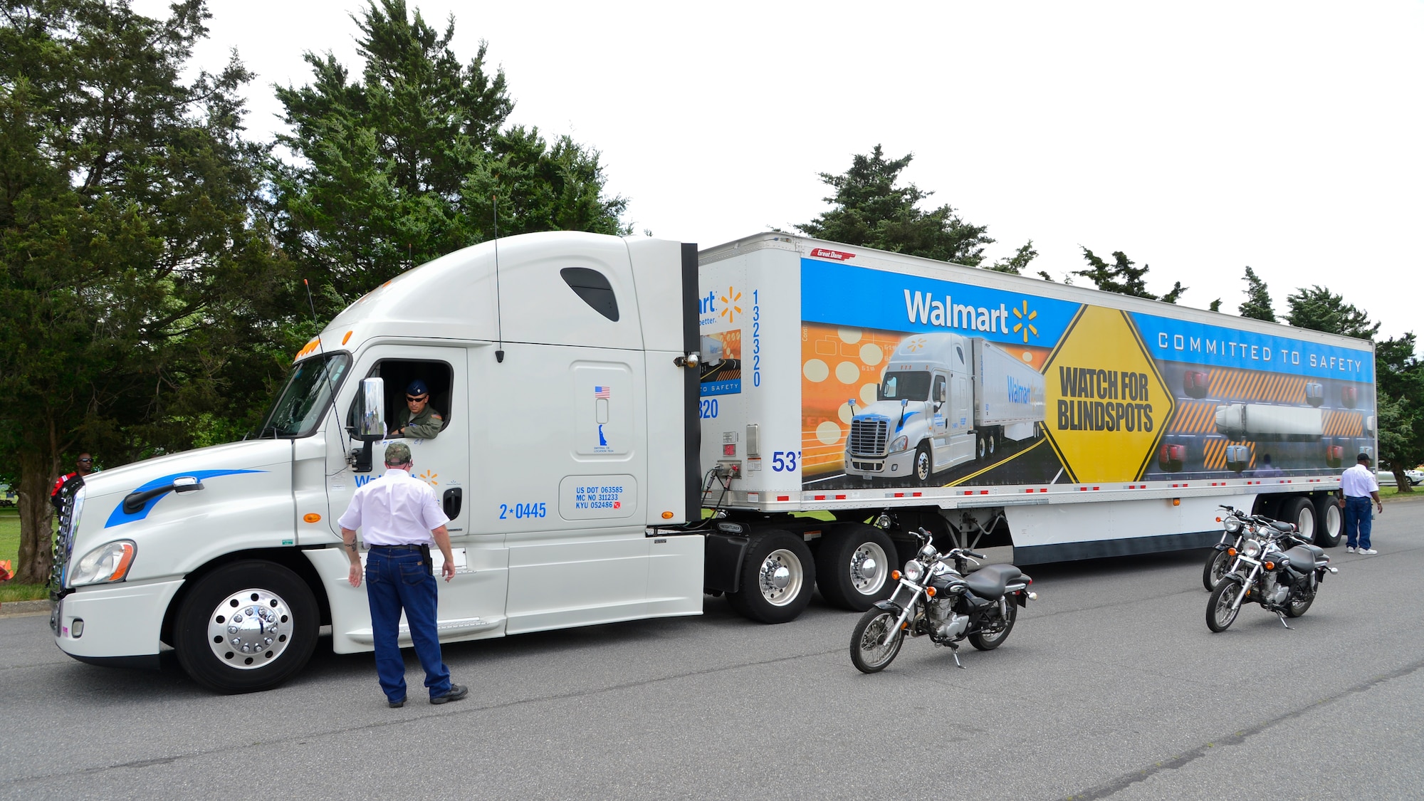 Lt. Col. Mark Radio, 436th Airlift Wing Safety chief, checks for motorcycles in a blind spot demonstration at Motorcycle Safety Day June 19, 2015, at Dover Air Force Base, Del. The blind spot truck teaches riders how to identify and avoid a truck’s blind spot. (U.S. Air Force photo/Airman 1st Class William Johnson)