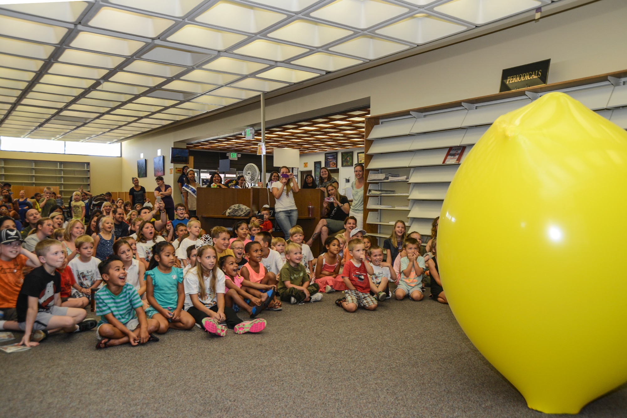 Annie Banannie fights to escape a giant balloon in her grand finale June 19 at the base library. Her story reaches its peak as Annie finds herself inside an enormously sized balloon, while viewers anxiously await the conclusion of her story. While the nature of the giant balloon was uncertain, an abundance of theories were quickly developed by onlookers on what this meant for Annie and the story’s conclusion. (U.S. Air Force photo by Patric Lovato)