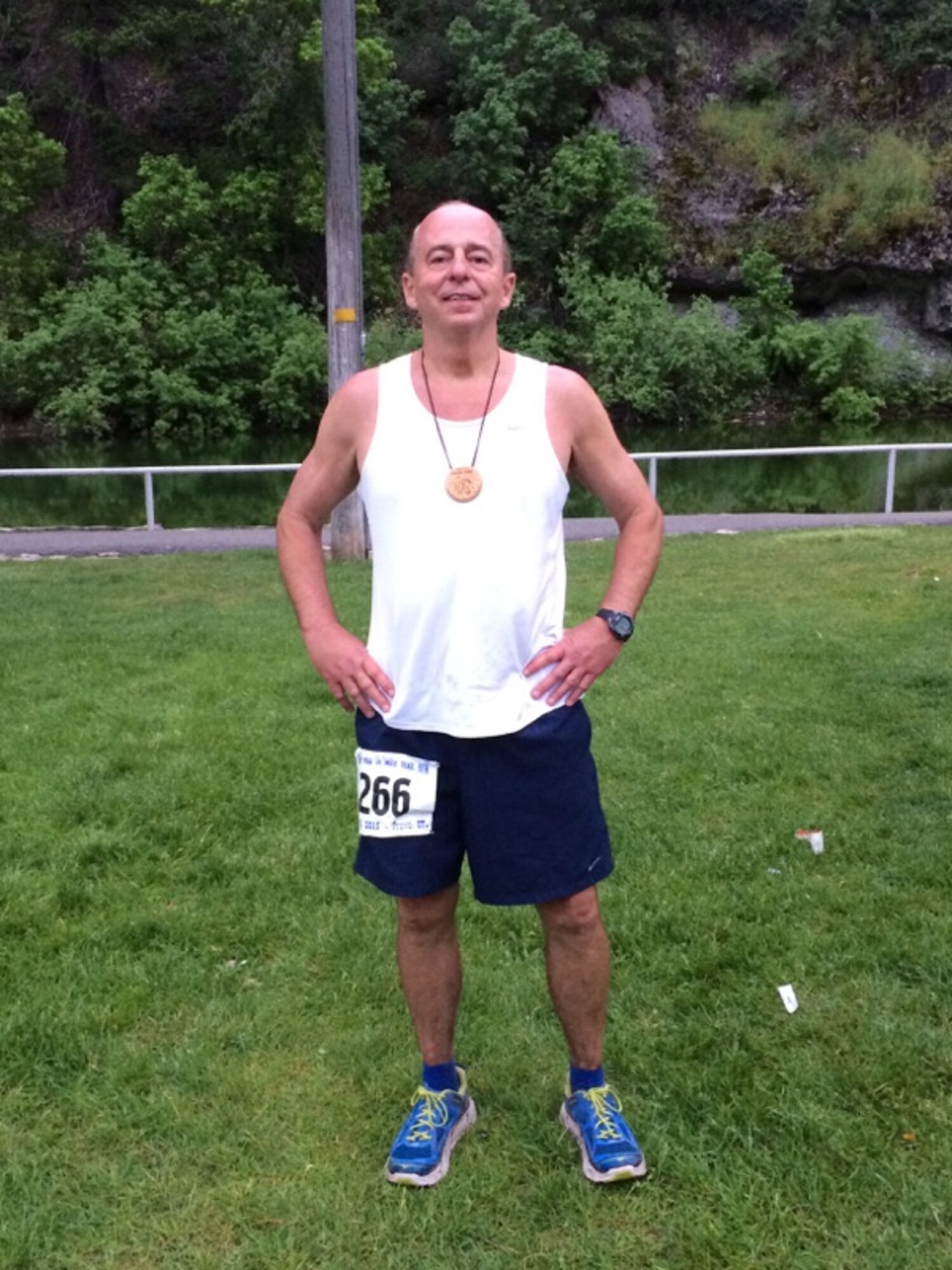21st Space Wing Director of Staff Al Strait poses with the medal he earned completing the Squaw Peak 50 Mile trail run above Provo, Utah June 6. The retired Air Force colonel applied resiliency learned during his military career to bounce back after not finishing the course in 2012. He completed the rocky, mountainous course in 16:22.