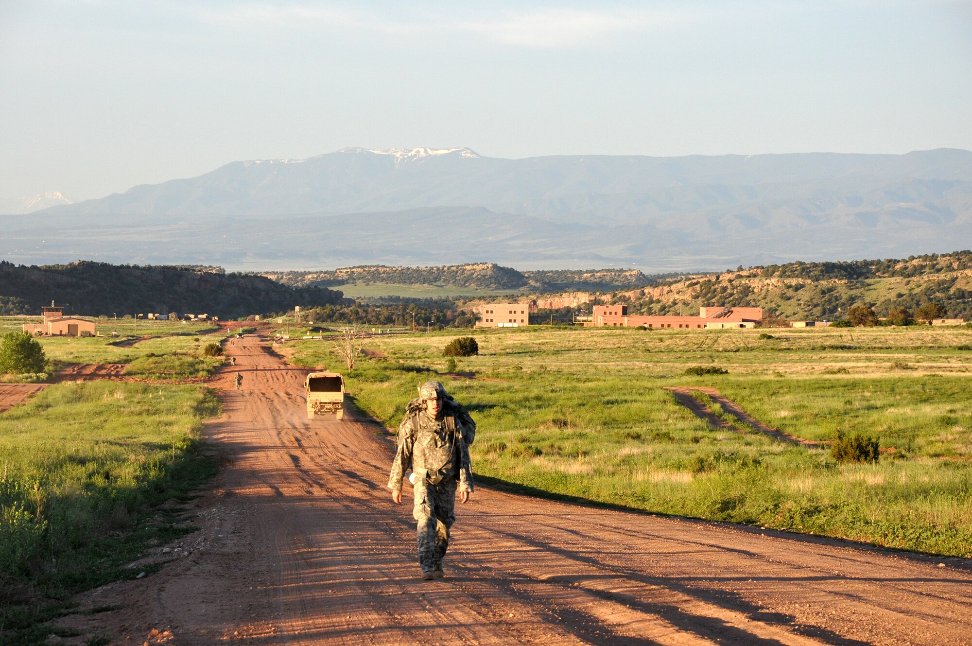As part of the U.S. Army Space and Missile Defense Command/Army Forces Strategic Command Best Warrior Competition, Soldiers compete in the early hours of the morning June 9 during the 12-mile foot march while carrying a 30-pound ruck at Fort Carson, Colo. (Courtesy photo by Dottie White)