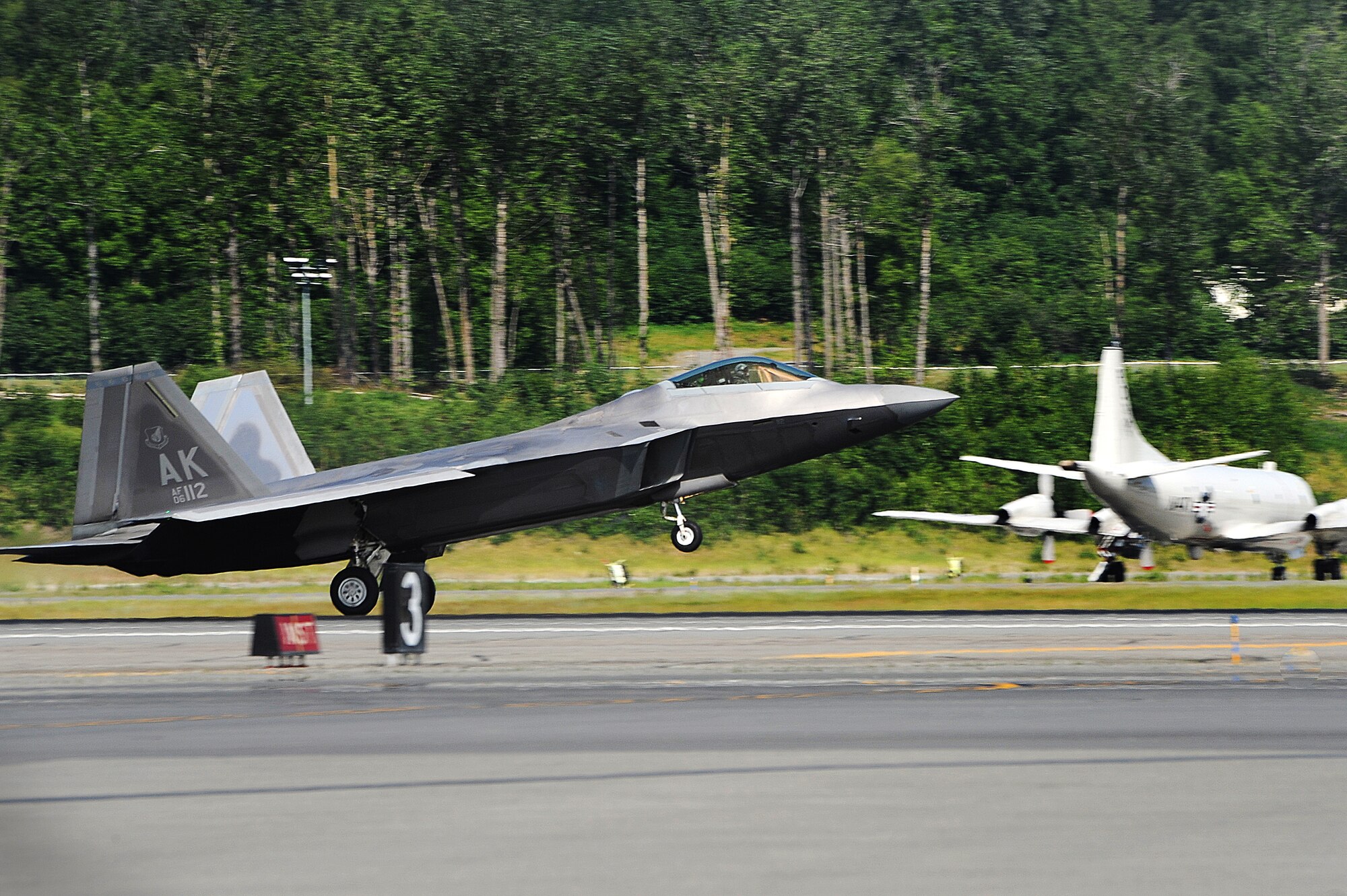 A F-22 Raptor from the 525 Fighter Squadron returns from a mission during Exercise Northern Edge 15 at Joint Base Elmendorf-Richardson, June 18, 2015. Northern Edge 15 is Alaska’s premier joint training exercise designed to practice operations, techniques and procedures as well as enhance interoperability among the services. Thousands of participants from all services; active duty, Reserve and National Guard units are involved. (U.S. Air Force photo by Staff Sgt. William Banton)‪