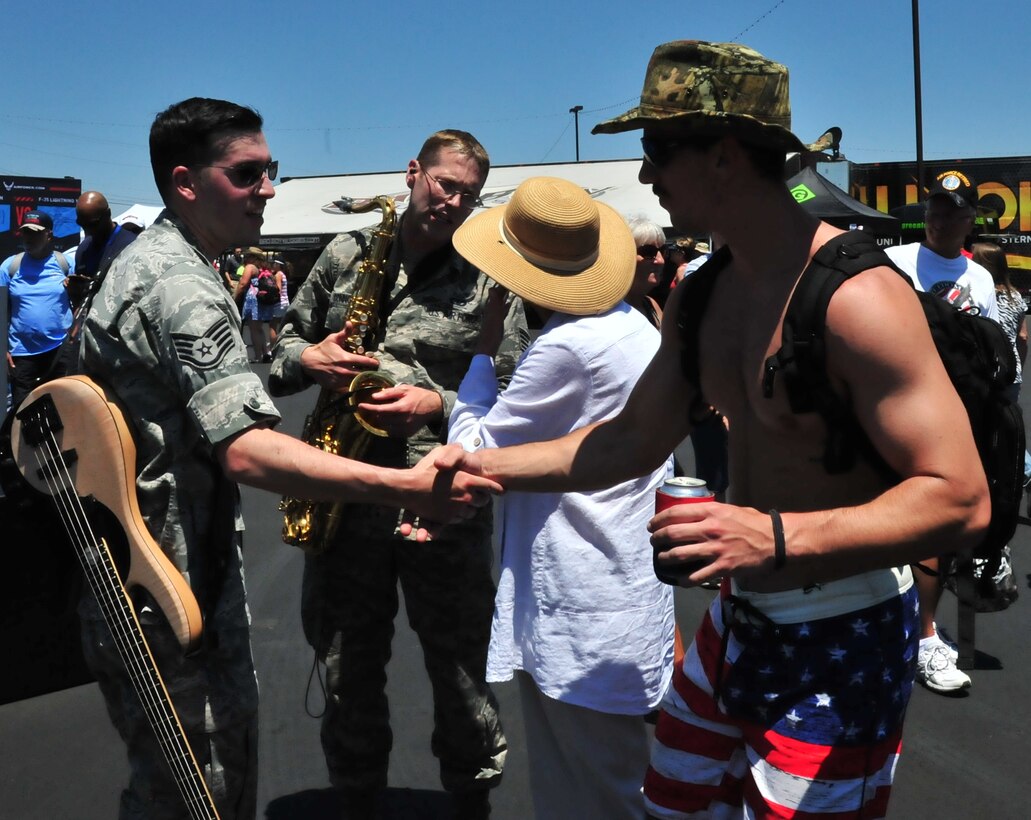SSgt Jordan Kimble greets a fan after Full Spectrum's pregame performance at NASCAR's Hisense 300 at Charlotte Motor Speedway.