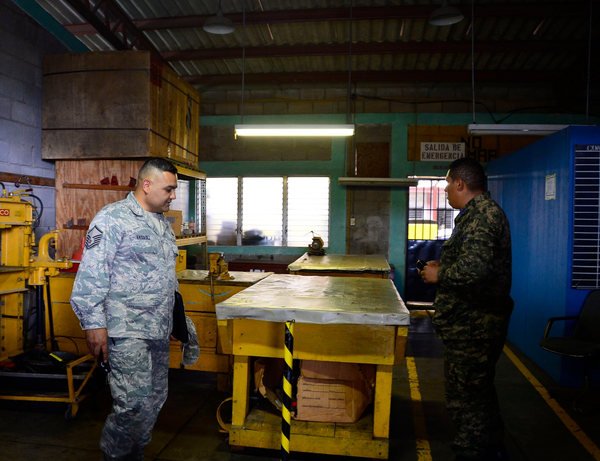 U.S. Air Force Master Sgt. Roberto Vasquez, superintendent of 12th Air Force (Air Forces Southern) Plans, Requirements, and Programs section, discusses the maintenance needs of the Honduran Air Force with Honduran Air Force Sgt. Marcotulio Avila, maintenance chief, stationed at Soto Cano Air Base in Comayagua, Honduras, June 17, 2015. A five-member assessment team from 12th AF (AFSOUTH), Davis-Monthan Air Force Base, Ariz., and the 571st Mobility Support Advisory Squadron from Travis Air Force Base, Cali., focused on the communication, intelligence collection and analysis, and  maintenance capabilities at Hernan Acosta Mejia Air Base, Soto Cano Air Base, Armand Escalon Espinal Air Base and Hector Caraccioli Moncada Air Base. (U.S. Air Force photo by Tech. Sgt. Heather R. Redman/Released)