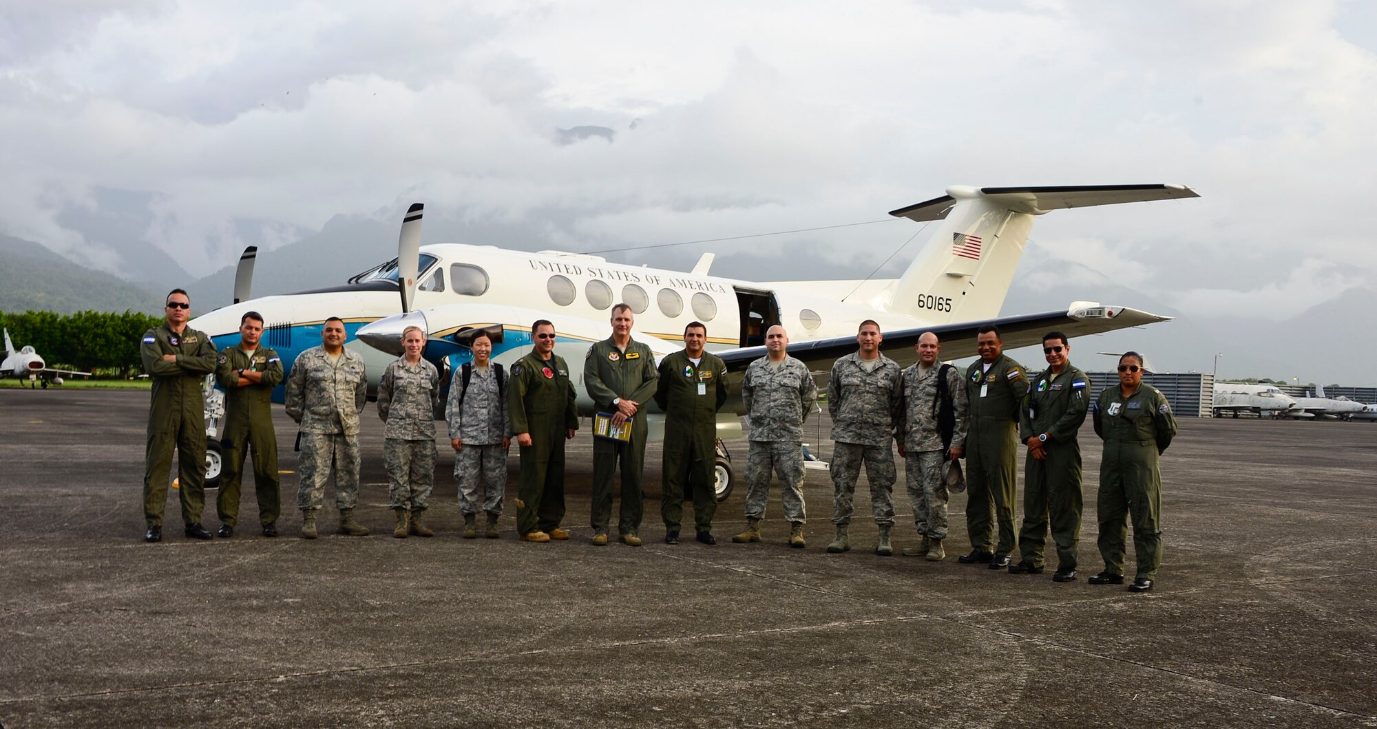 A five-member assessment team from 12th  Air Force (Air Forces Southern), Davis-Monthan Air Force Base, Ariz., and the 571st Mobility Support Advisory Squadron from Travis Air Force Base, Cali., pose with U.S. Embassy officials and members from the Honduran air force during a capabilities assessment of Col Hector Caraccioli Moncada Air Base, La Ceiba, Honduras, June 18, 2015. The team focused on the communication, intelligence collection and analysis, and maintenance capabilities at Hernan Acosta Mejia Air Base, Soto Cano Air Base, Armand Escalon Espinal Air Base and Hector Caraccioli Moncada Air Base. (U.S. Air Force photo by Tech. Sgt. Heather R. Redman/Released)