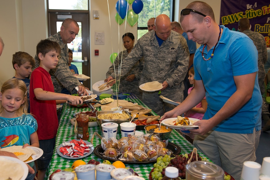 Participants fill their plates during the Youth Program’s Father’s Day Breakfast June 19, 2015, at Moody Air Force Base, Ga. The breakfast gave the children an opportunity to spend quality time with their fathers. (U.S. Air Force photo by Airman 1st Class Kathleen D. Bryant/Released)
