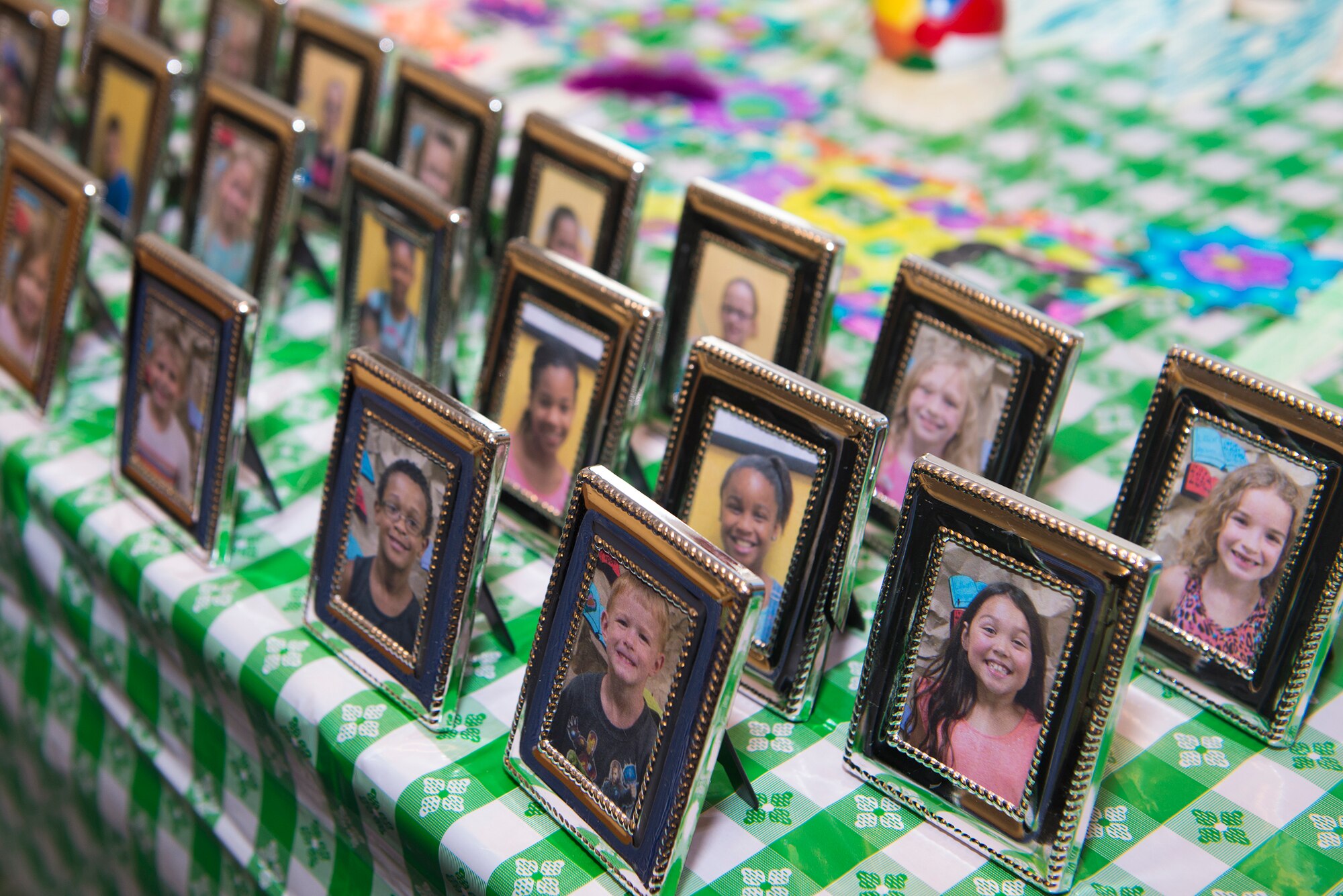 Photos of Team Moody children rest on a table during the Youth Program’s Father’s Day Breakfast June 19, 2015, at Moody Air Force Base, Ga. The children presented their fathers with their photo in honor of Father’s Day. (U.S. Air Force photo by Airman 1st Class Kathleen D. Bryant/Released) 