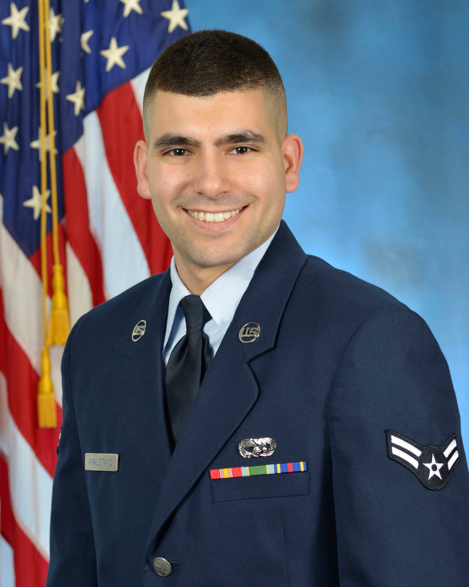 Airman 1st Class Vito Amalfitano, storage management technician for the Joint Personal Property Shipping Office-Northeast at Hanscom Air Force Base, Mass., overcame significant challenges in his background to enter the Air Force. (U.S. Air Force photo by Linda LaBonte Britt)
