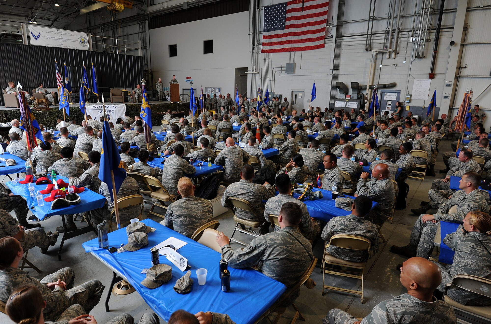 DOBBINS AIR RESERVE BASE, Ga. - 87th Aerial Port Squadron Airmen and their counterparts attend the closing ceremonies inside a hangar at the Transportation Proficiency Center during the Port Dawg Challenge at Dobbins Air Reserve Base, Ga., June 18, 2015. The Port Dawg Challenge was created to enhance and maintain the camaraderie, esprit de corps and prestige of Aerial Port Airmen while promoting professionalism, leadership, training and communication between "Port Dawgs." (U.S. Air Force photo by Tech. Sgt. Stephen D. Schester/Released)
