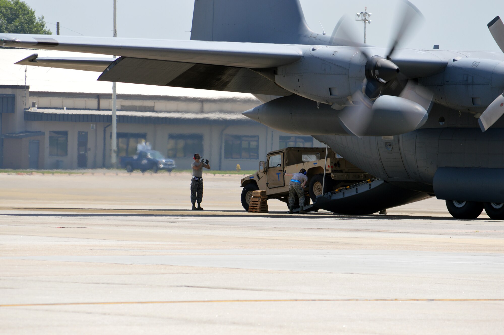 DOBBINS AIR RESERVE BASE, Ga. - 87th Aerial Port Squadron Airmen compete in the Aerial Port Engine Running On-load (ERO) competition load cargo onto a C-130 Hercules aircraft during the Port Dawg Challenge at Dobbins Air Reserve Base, Ga., June 16, 2015. The Port Dawg Challenge was created to enhance and maintain the camaraderie, esprit de corps and prestige of aerial port Airmen while promoting professionalism, leadership, training and communication between "Port Dawgs." (Courtesy photo))