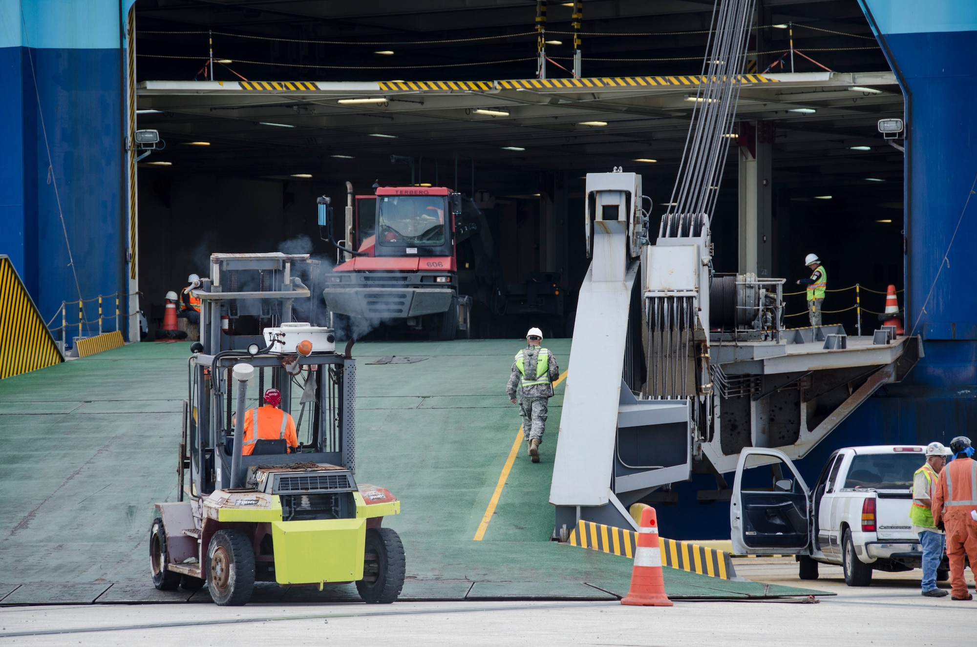 841st Transportation Battalion personnel load vehicles and equipment onto a Korean carrier during a U.S. Transportation Command Surface Deployment and Distribution Command mission, June 19, 2015 at Joint Base Charleston – Weapons Station, S.C. SDDC is the Army Service Component Command of the USTRANSCOM and is a major subordinate command to Army Materiel Command. This relationship links USTRANSCOM’s Joint Deployment and Distribution Enterprise and Army Materiel Command Materiel Enterprise. The command also partners with the commercial transportation industry as the coordinating link between DOD surface transportation requirements and the capability industry provides. (U.S. Air Force photo/Staff Sgt. AJ Hyatt)