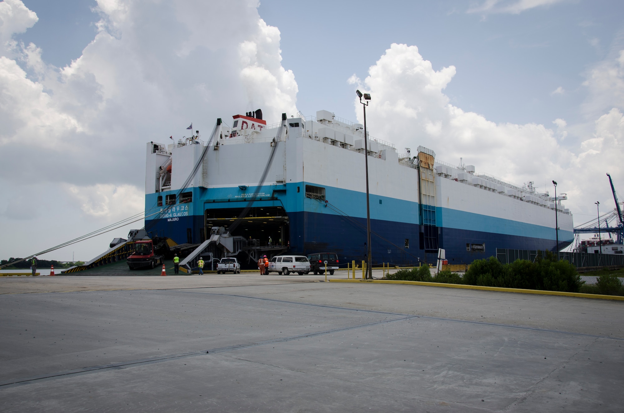 841st Transportation Battalion personnel load vehicles and equipment onto a Korean carrier during a U.S. Transportation Command Surface Deployment and Distribution Command mission, June 19, 2015 at Joint Base Charleston – Weapons Station, S.C. SDDC is the Army Service Component Command of the USTRANSCOM and is a major subordinate command to Army Materiel Command. This relationship links USTRANSCOM’s Joint Deployment and Distribution Enterprise and Army Materiel Command Materiel Enterprise. The command also partners with the commercial transportation industry as the coordinating link between DOD surface transportation requirements and the capability industry provides. (U.S. Air Force photo/Staff Sgt. AJ Hyatt)