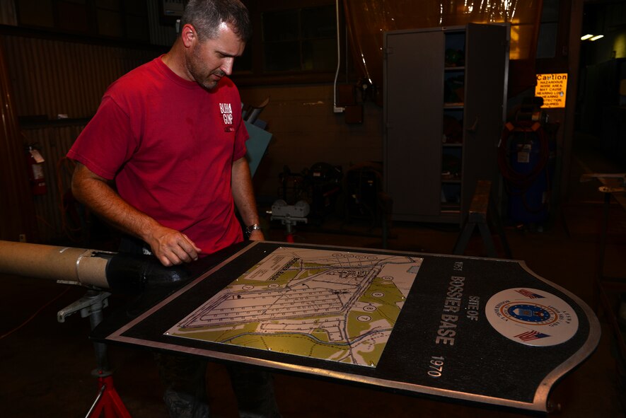 Tech. Sgt. Mark Chumley, 2nd Civil Engineer Squadron facility welder, looks over the map of Bossier Base, on Barksdale Air Force Base, La., June 17, 2015. For over 84 years Barksdale has seen a large variety of aircraft, squadrons, groups, and commands, all with unique missions. (U.S. Air Force photo/Airman 1st Class Luke Hill)