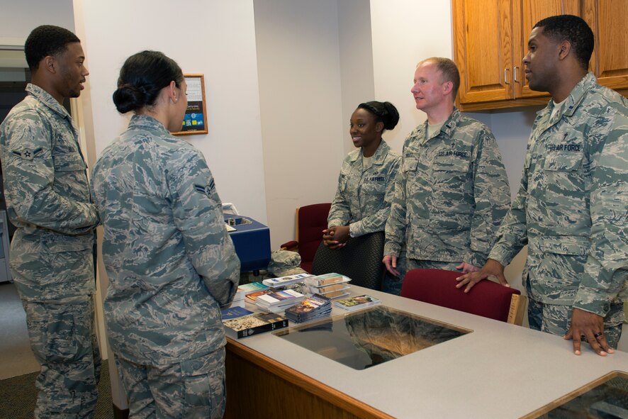 U.S. Air Force Chaplains (Lts.) Bernard Grace, right, and Erik Britt, 23d Wing chaplains, along with SSgt Erica Jones, chaplain assistant, speak with Airmen during a deployment briefing June 18, 2015, at Moody Air Force Base, Ga. Chaplains provide religious and counseling services to Airmen at their home station, overseas and deployed. (U.S. Air Force photo by Airman 1st Class Kathleen D. Bryant/Released)