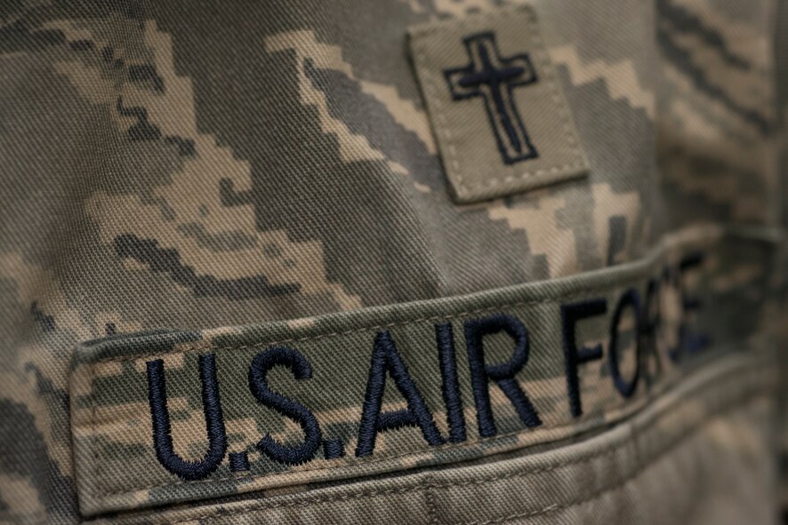 A chaplain’s occupational badge rests on a uniform June 22, 2015, at Moody Air Force Base, Ga. Chaplains dedicate themselves to being a resource for Airmen, civilians and dependents 24/7. (U.S. Air Force photo by Airman 1st Class Kathleen D. Bryant/Released)