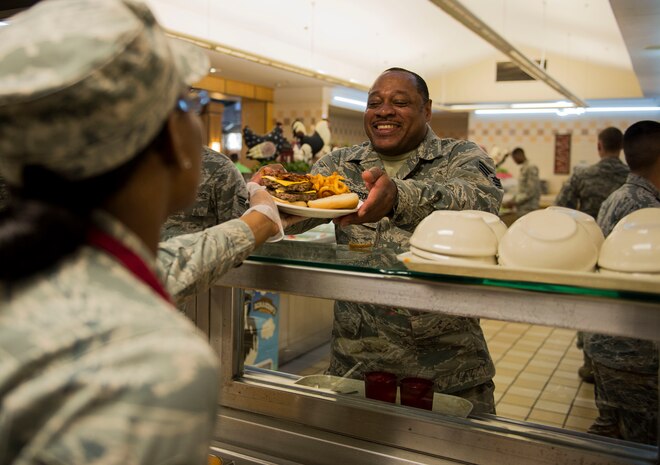 Staff Sgt. Tamika Taylor, 440th Force Support Squadron services journeyman serves food at the Gaylor Dining Facility, April 08, 2015. Airmen from the 628th Force Support Squadron  Gaylor Dining Facility and their Reserve counterparts from the 440th FSS are tasked with providing meals to thousands of fellow Airmen daily. (U.S. Air Force photo by Staff Sgt. Kenneth W. Norman)

