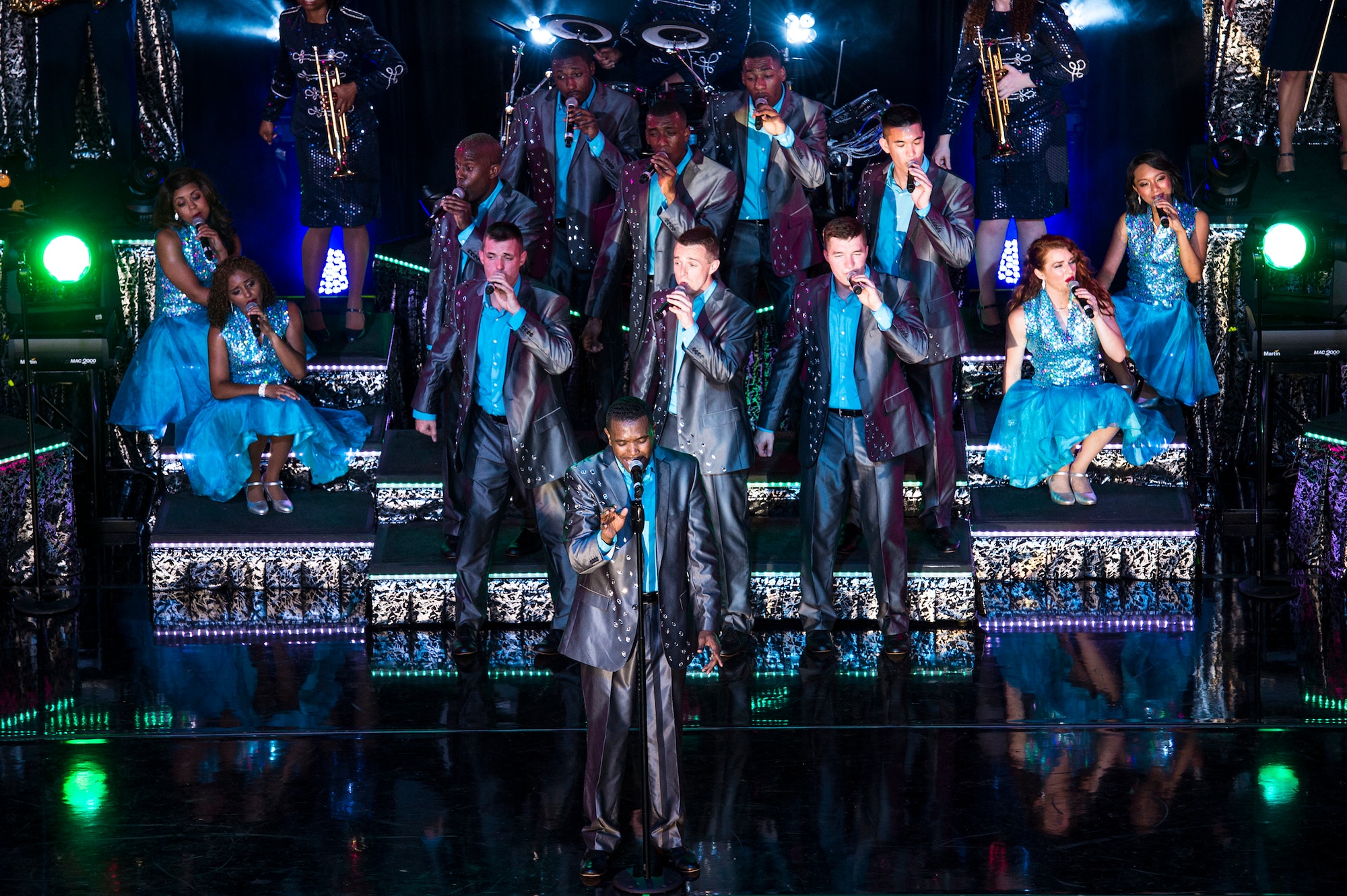 Tops in Blue entertainers perform a coordinated dance routine during a performance June 12, 2015, at Wild Adventures in Valdosta, Ga.  Valdosta was the second stop on the seven-month 2015 Tops in Blue world tour. (U.S. Air Force photo by Senior Airman Ryan Callaghan/Released)

