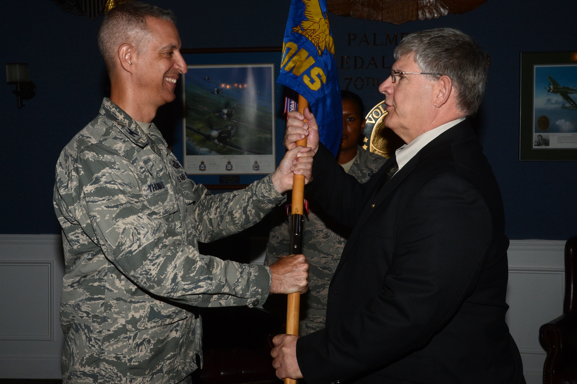 Randall May, 20th Contracting Squadron director, assumes leadership of the squadron from Col. John Thomas, 20th Mission Support Group commander, during an Assumption of Leadership ceremony at Shaw Air Force Base, S.C., June 16, 2015. May, who has been with the squadron since 2001, has worked for the squadron as a team lead, contract specialist, flight chief and as the director of business operations. (U.S. Air Force photo by Senior Airman Jonathan Bass/Released)