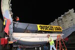 A C-17 Globemaster II fuselage began its journey from the 502nd Trainer Development Squadron at Joint Base San Antonio-Randolph June 23, 2015.  Since its arrival via flatbed truck in 2011, the fuselage was transformed into the Air Force’s first fully functioning aeromedical evacuation trainer.  The C-17 will be used to train more than 1,300 flight nurses, aeromedical technicians, critical care physicians, intensive care nurses, respiratory nurses and flight surgeons annually at the U.S. Air Force School of Aerospace Medicine at Wright Patterson Air Force Base, Ohio. The fuselage is the last piece to be delivered and its trek will take about 10 days and then reassembly begins. (U.S. Air Force photo by Senior Airman Alexandria Slade)

