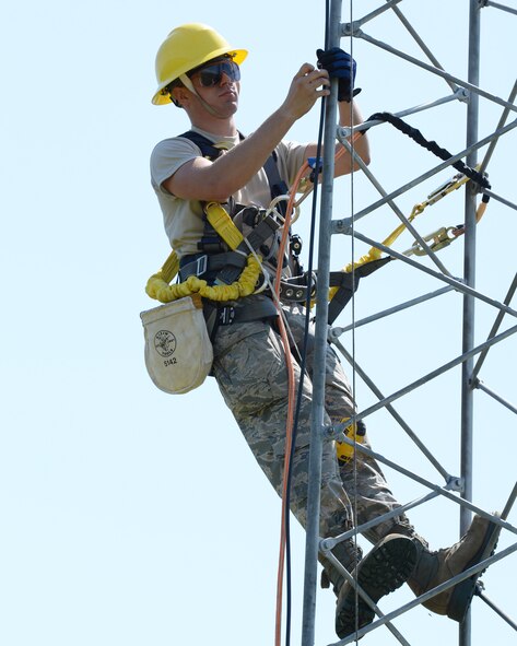 Airman 1st Class Mark Dunton works on upgrading lightning protection and grounding on a communications tower at Pease Air National Guard Base, N.H., on June 22, 2015.The installation of the lightning protection gear helps protect resources such as radios that 157th Air Refueling Wing Airmen use to support the mission.  Dunton is assigned to the 243rd Engineering Installation Squadron, Maine Air National Guard in South Portland, Maine.  (U.S. Air National Guard photo by Staff Sgt. Curtis J. Lenz)