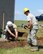 Master Sgt. Jason Bowen, team chief (left) steadies a grounding rod as Senior Airman Alexander Russo uses a sledge hammer to drive a grounding rod into the ground as part of lightning protection and grounding upgrades on communications equipment at Pease Air National Guard Base, N.H., on June 22, 2015. The installation of the lightning protection gear helps protect resources such as radios that 157th Air Refueling Wing Airmen use to support the mission.   The Airmen are assigned to the 243rd Engineering Installation Squadron, Maine Air National Guard in South Portland, Maine.  (U.S. Air National Guard photo by Staff Sgt. Curtis J. Lenz)